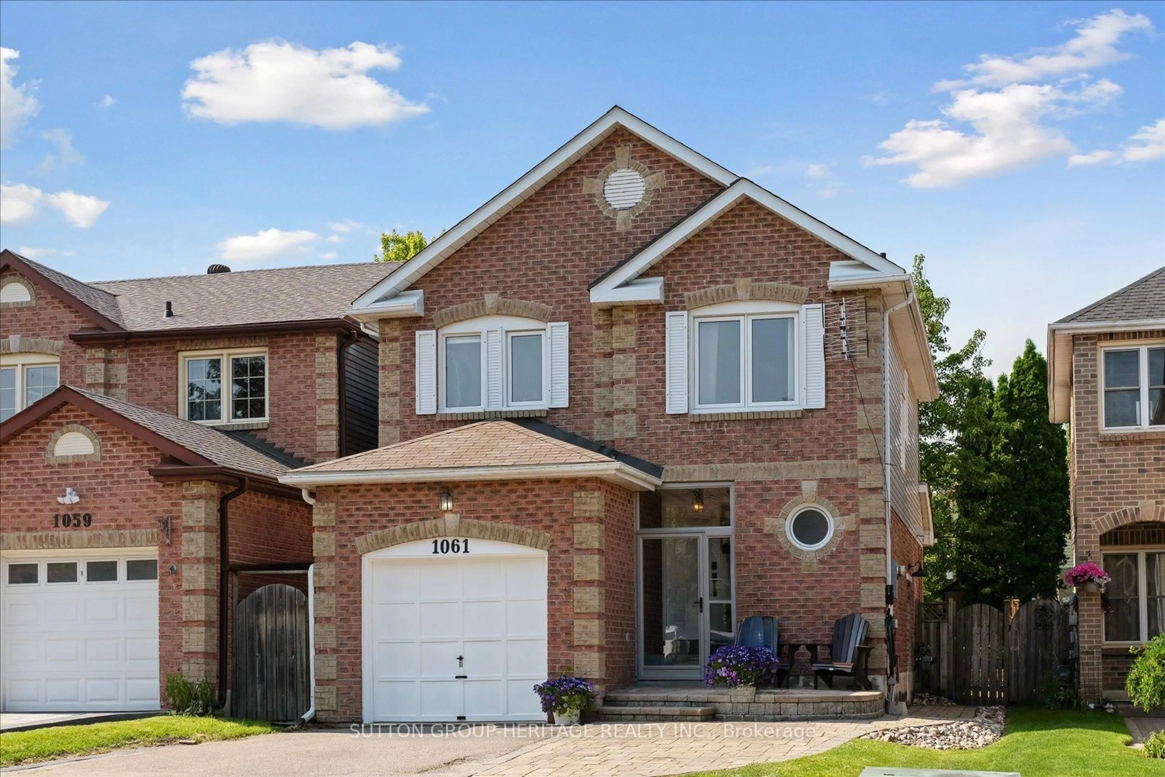Home with brick exterior material, street for 1061 Rowntree Cres, Pickering Ontario L1V 5A9
