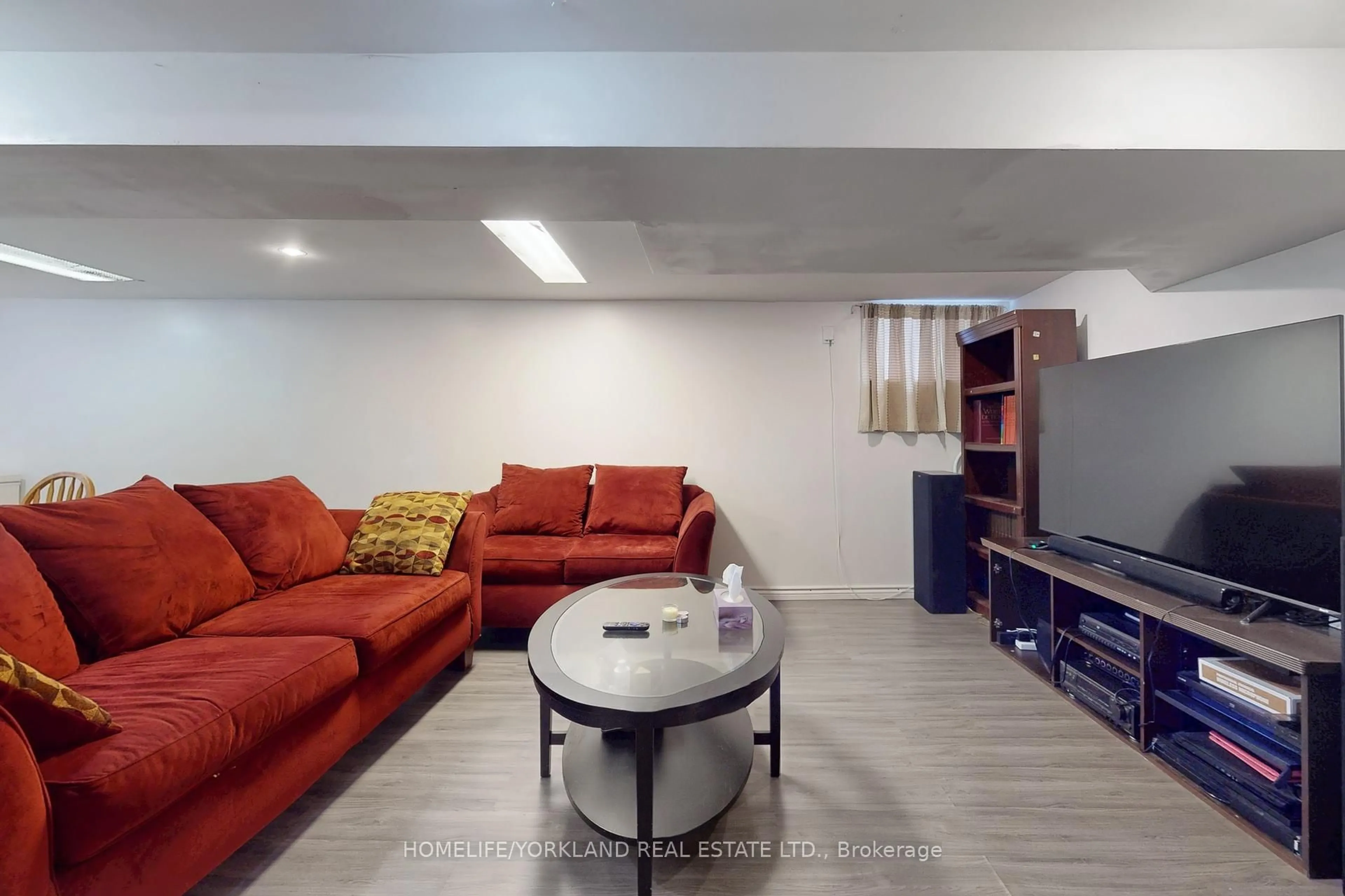 Living room with furniture, unknown for 30 Merrian Rd, Toronto Ontario M1K 3M7