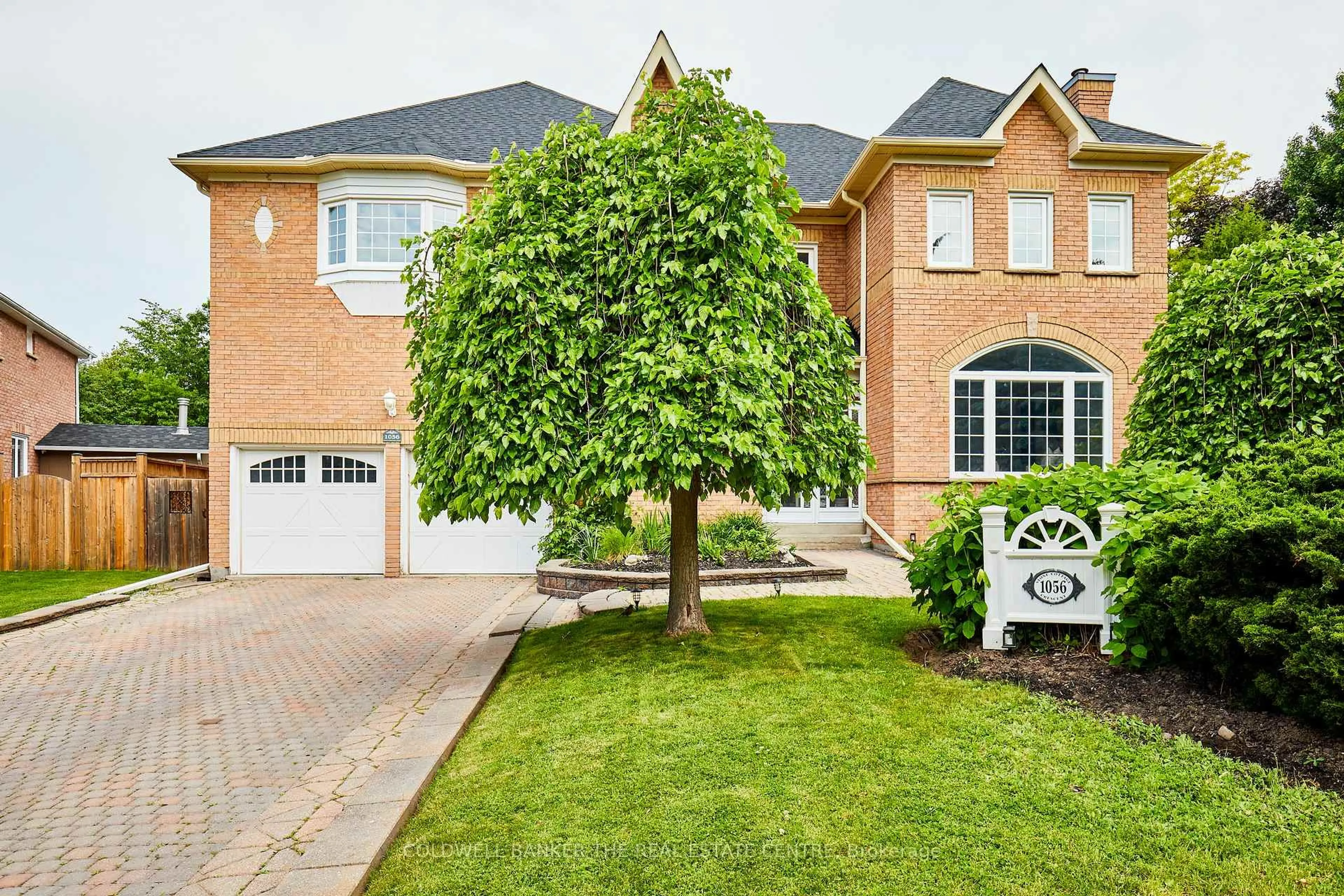 Home with brick exterior material, street for 1056 Stone Cottage Cres, Oshawa Ontario L1K 1Z4