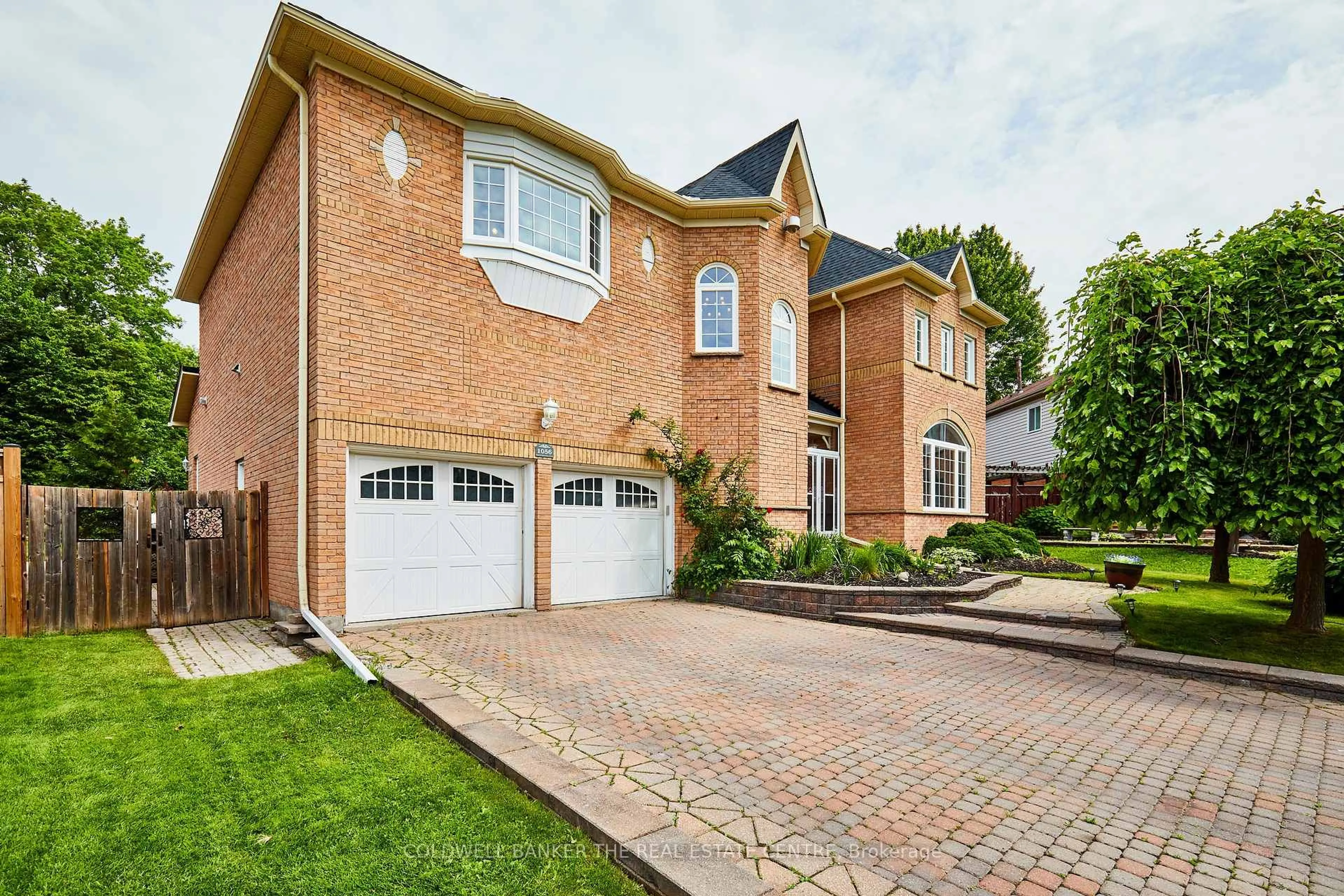 Home with brick exterior material, street for 1056 Stone Cottage Cres, Oshawa Ontario L1K 1Z4