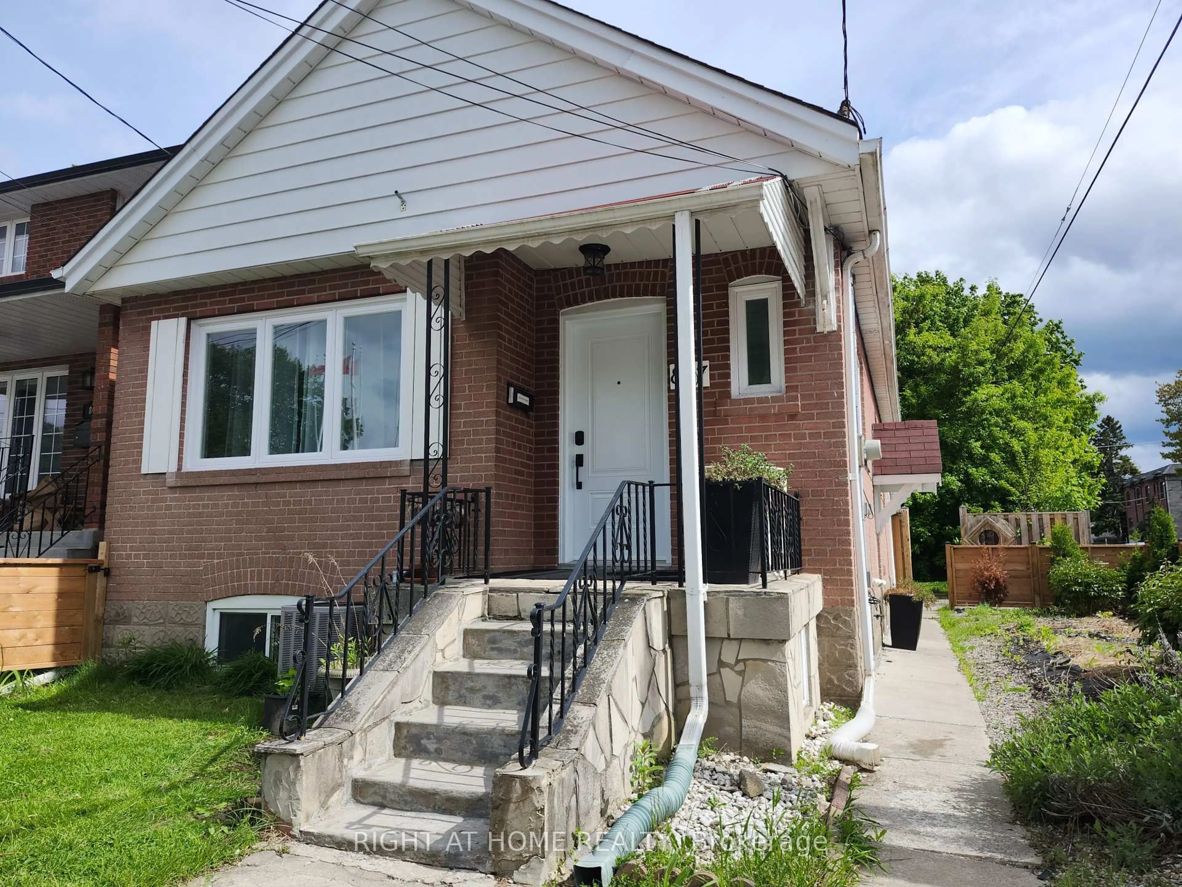Home with brick exterior material, street for 887 Cosburn Ave, Toronto Ontario M4C 2W5