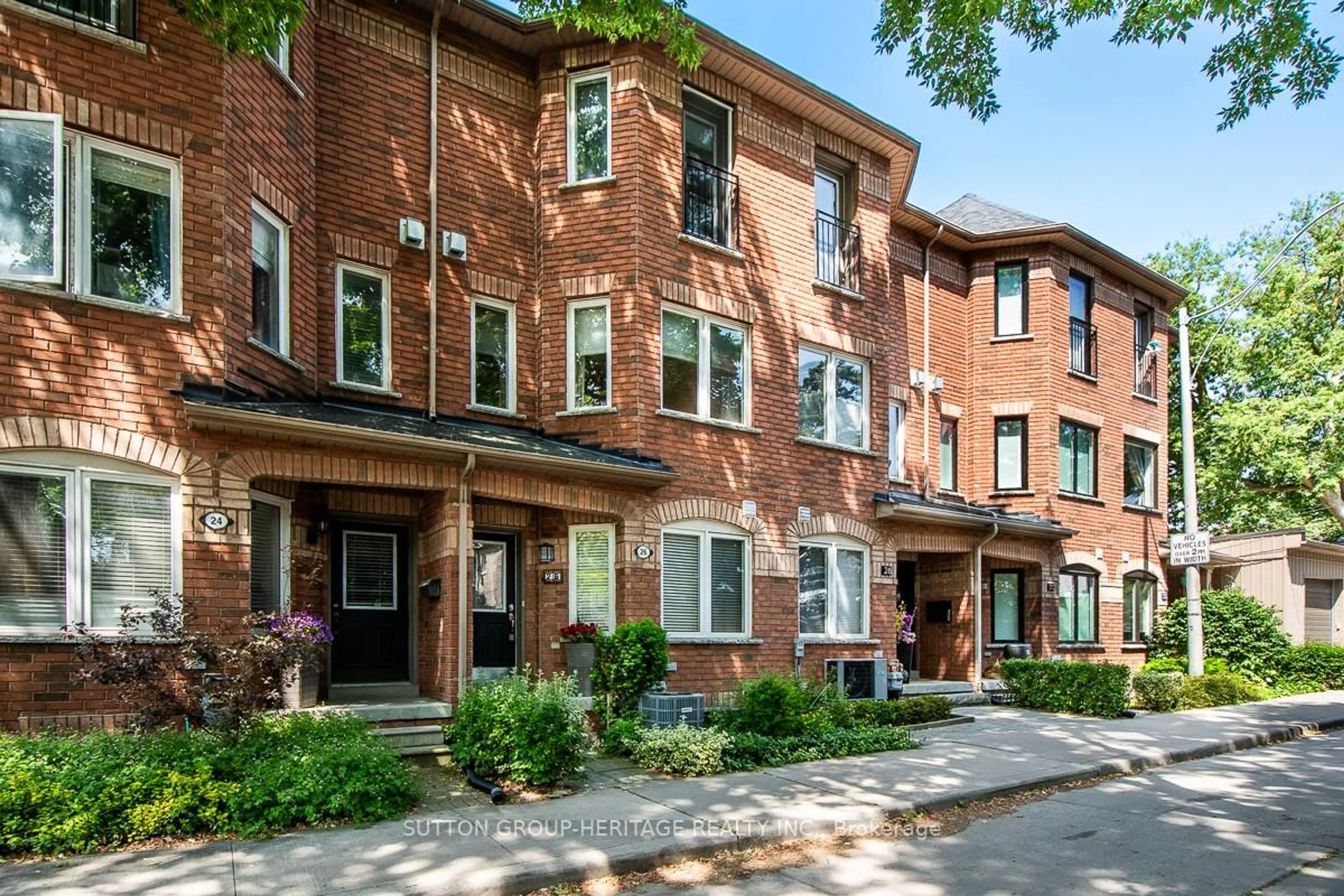 Home with brick exterior material, street for 26 Filmic Lane, Toronto Ontario M4M 3R1
