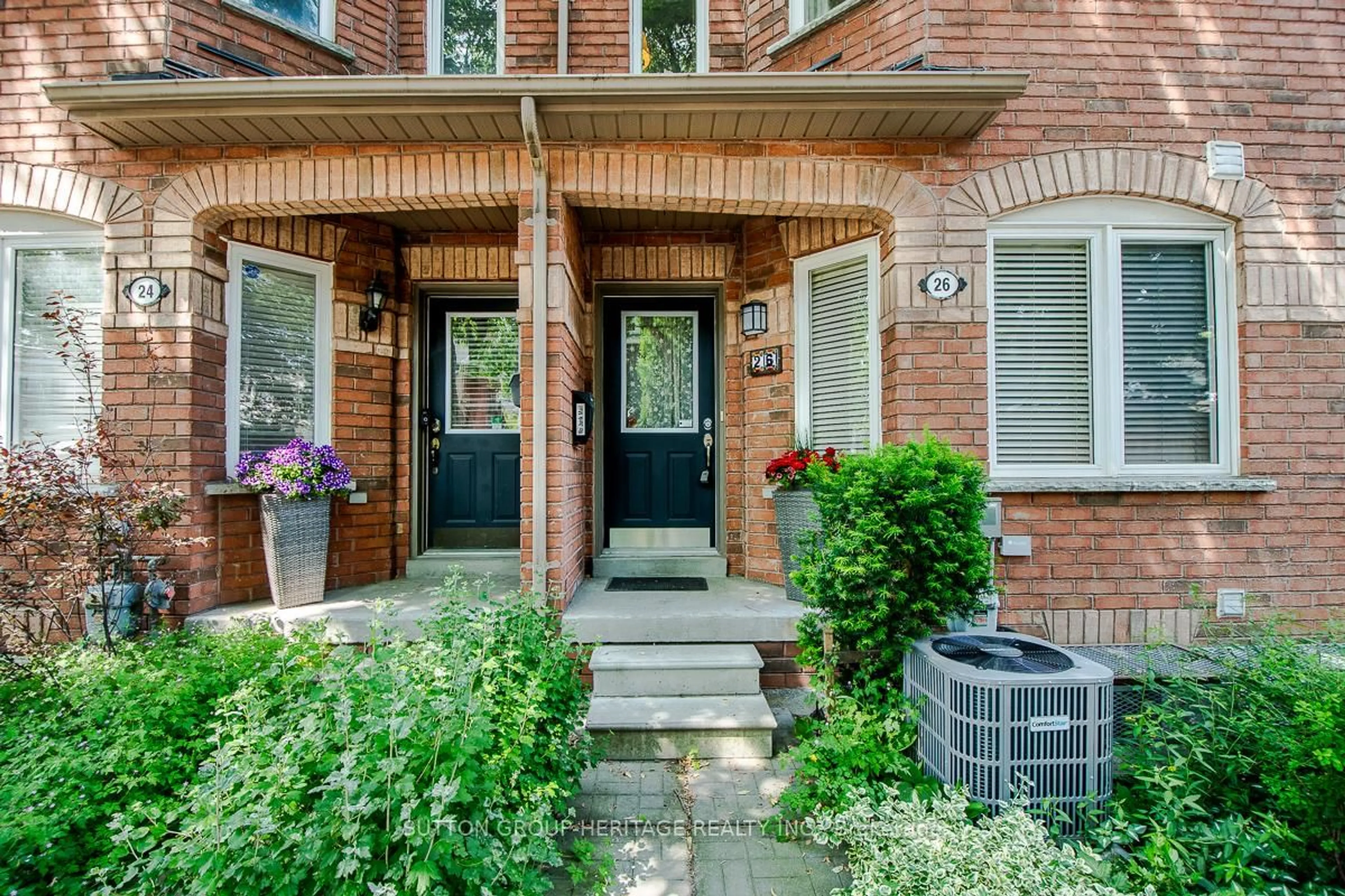 Home with brick exterior material, street for 26 Filmic Lane, Toronto Ontario M4M 3R1