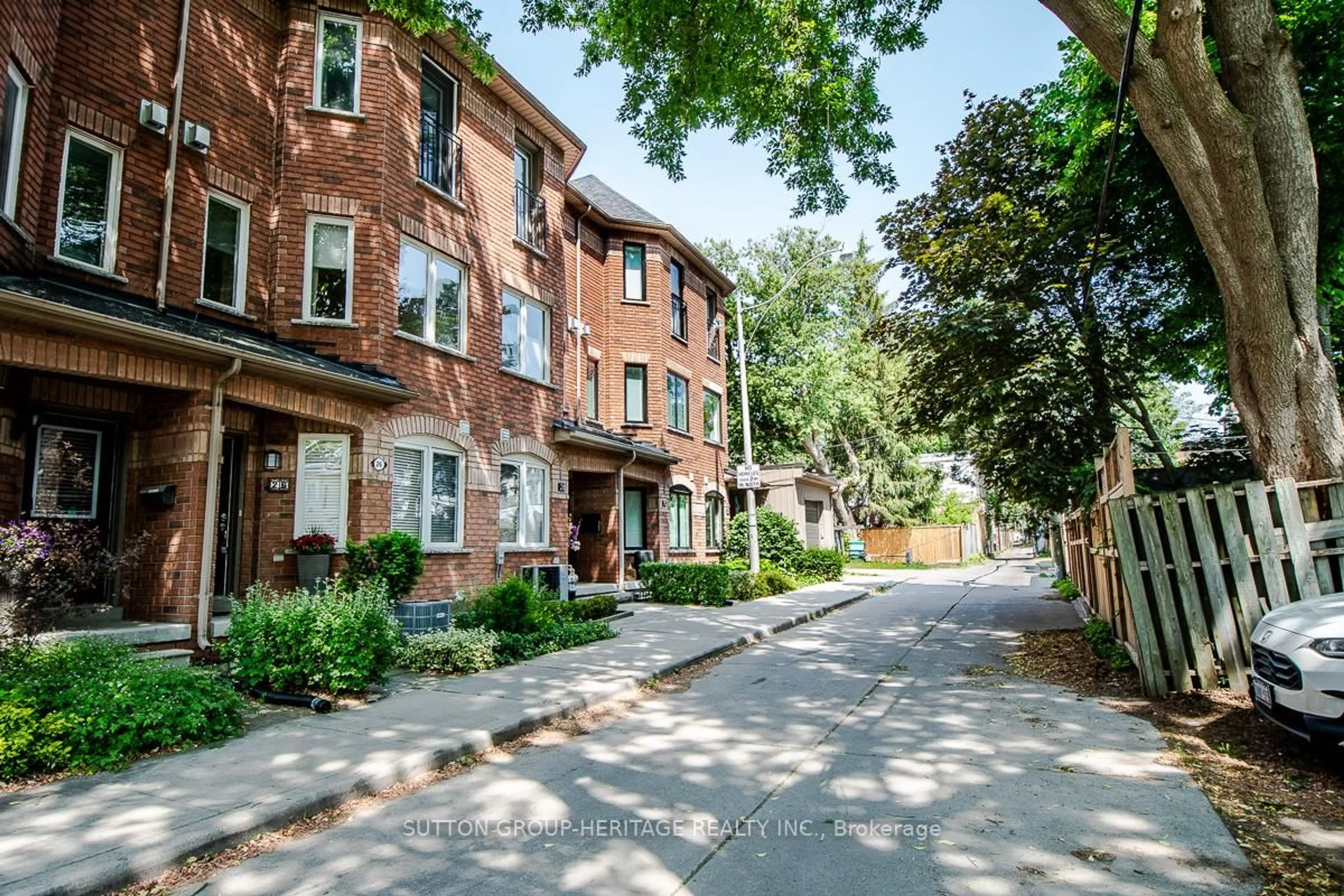 Home with brick exterior material, street for 26 Filmic Lane, Toronto Ontario M4M 3R1