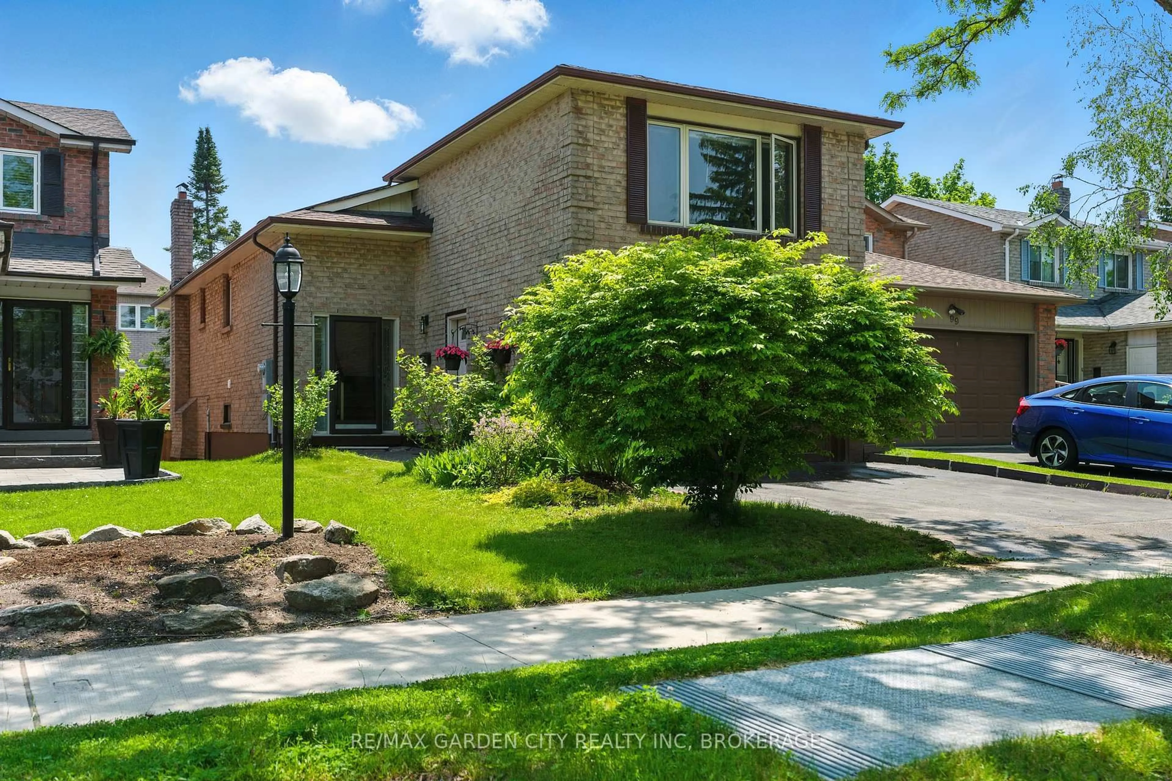 Home with brick exterior material, street for 101 Winter Gardens Tr, Toronto Ontario M1C 3M9