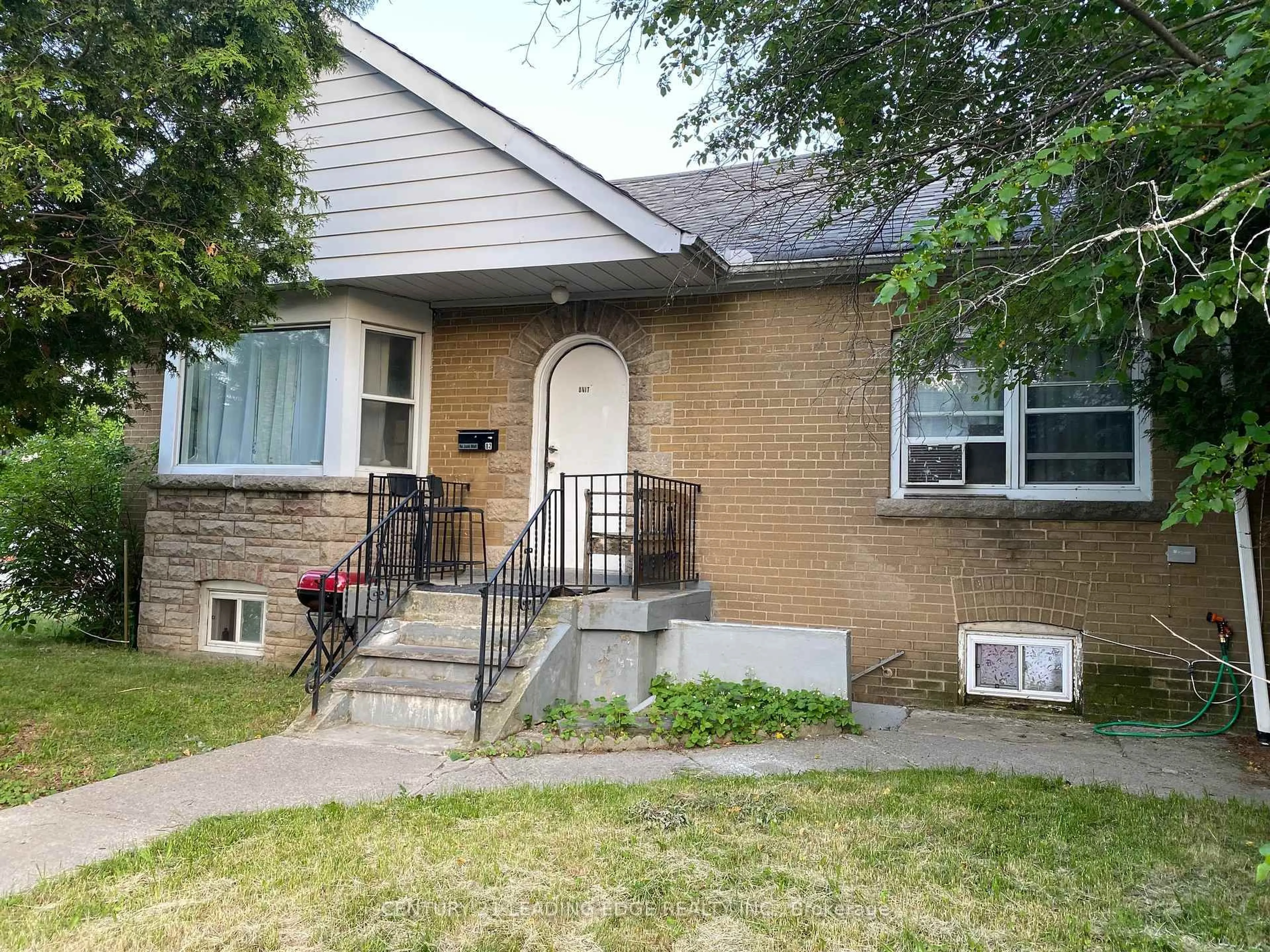 Home with brick exterior material, street for 82 Meighen Ave, Toronto Ontario M4B 2H5
