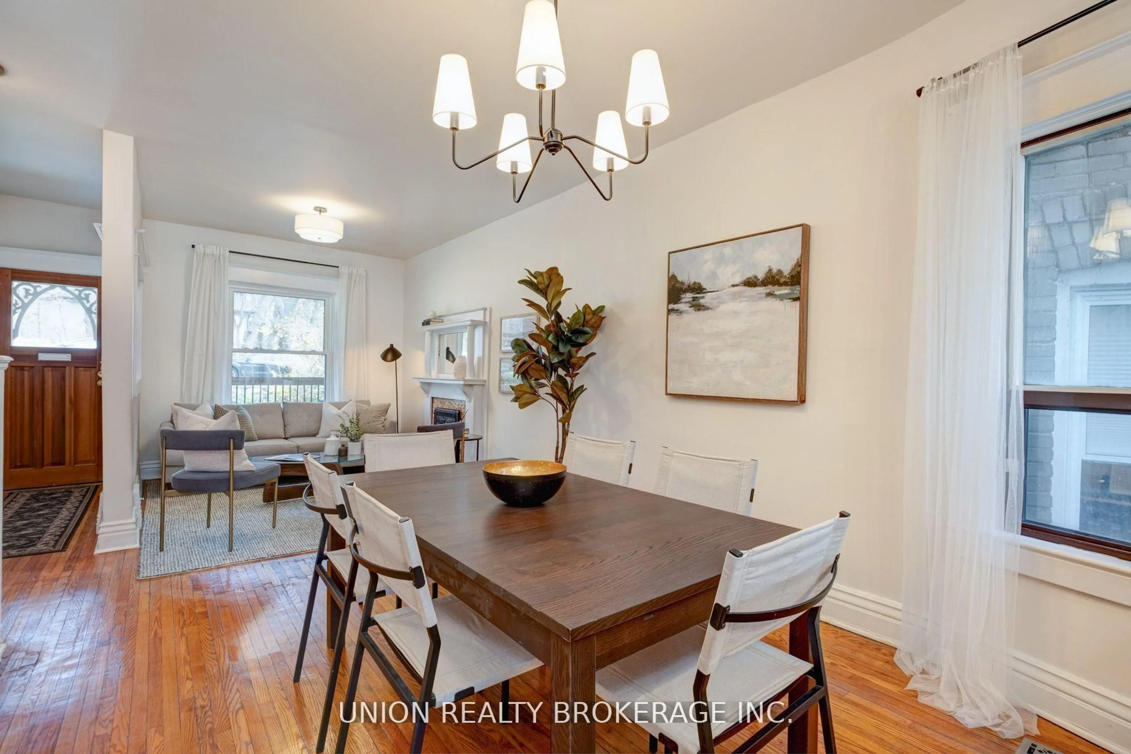 Dining room, wood/laminate floor for 146 Beech Ave, Toronto Ontario M4E 3H6