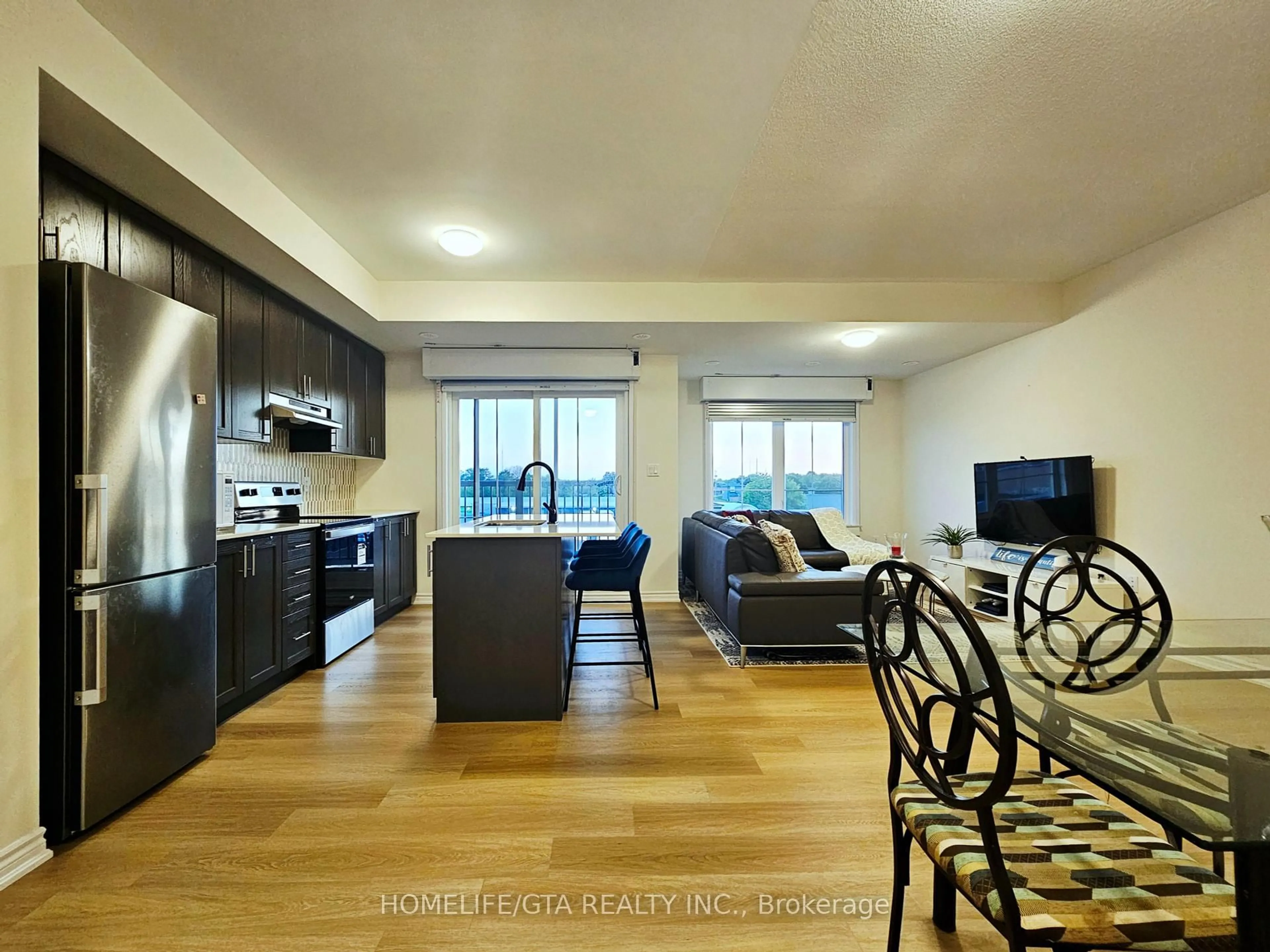 Open concept kitchen, wood/laminate floor for 480 Beresford Path #16, Oshawa Ontario L1H 0B2