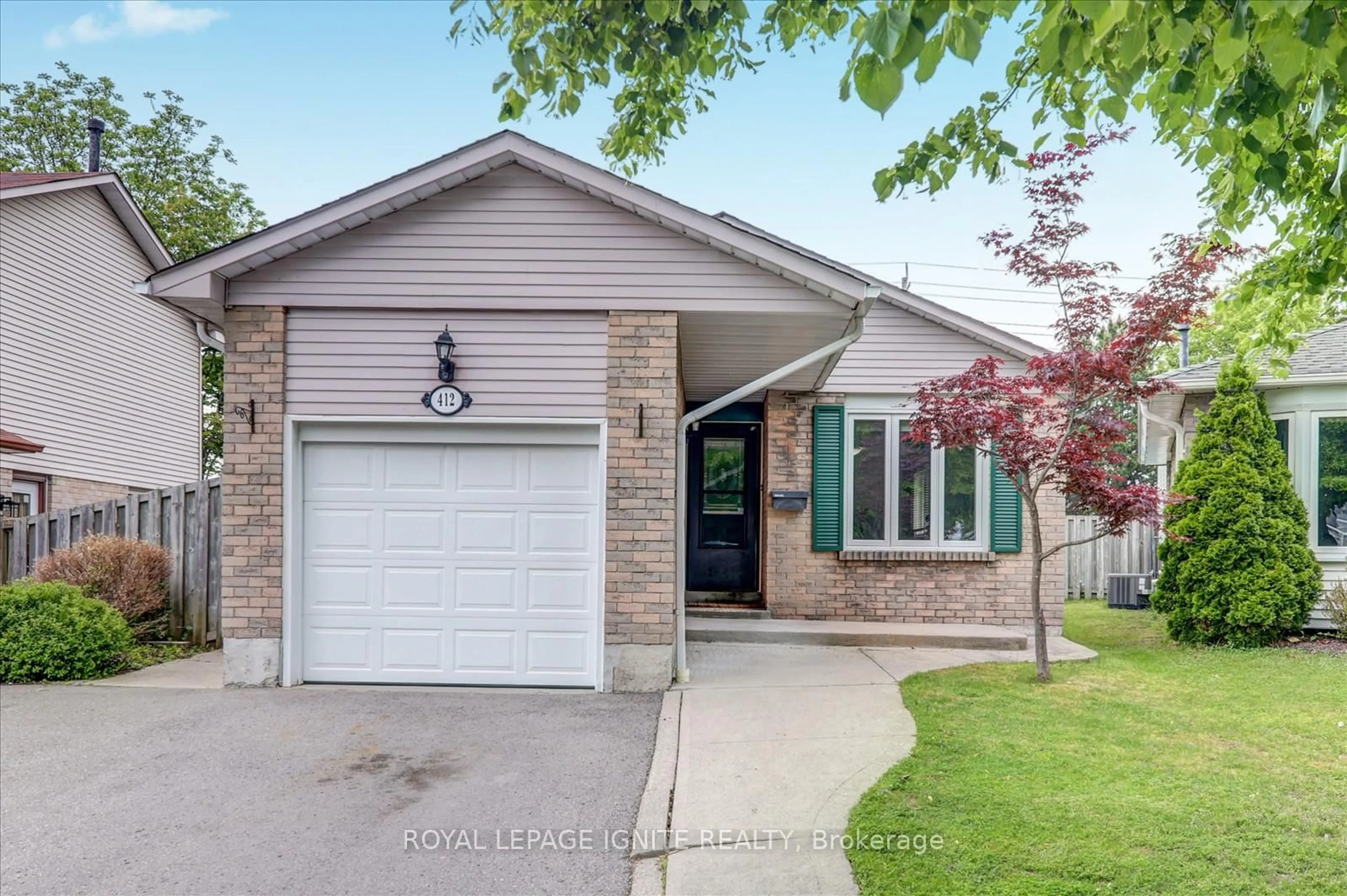 Home with brick exterior material, street for 412 Prince Of Wales Dr, Whitby Ontario L1N 6M9