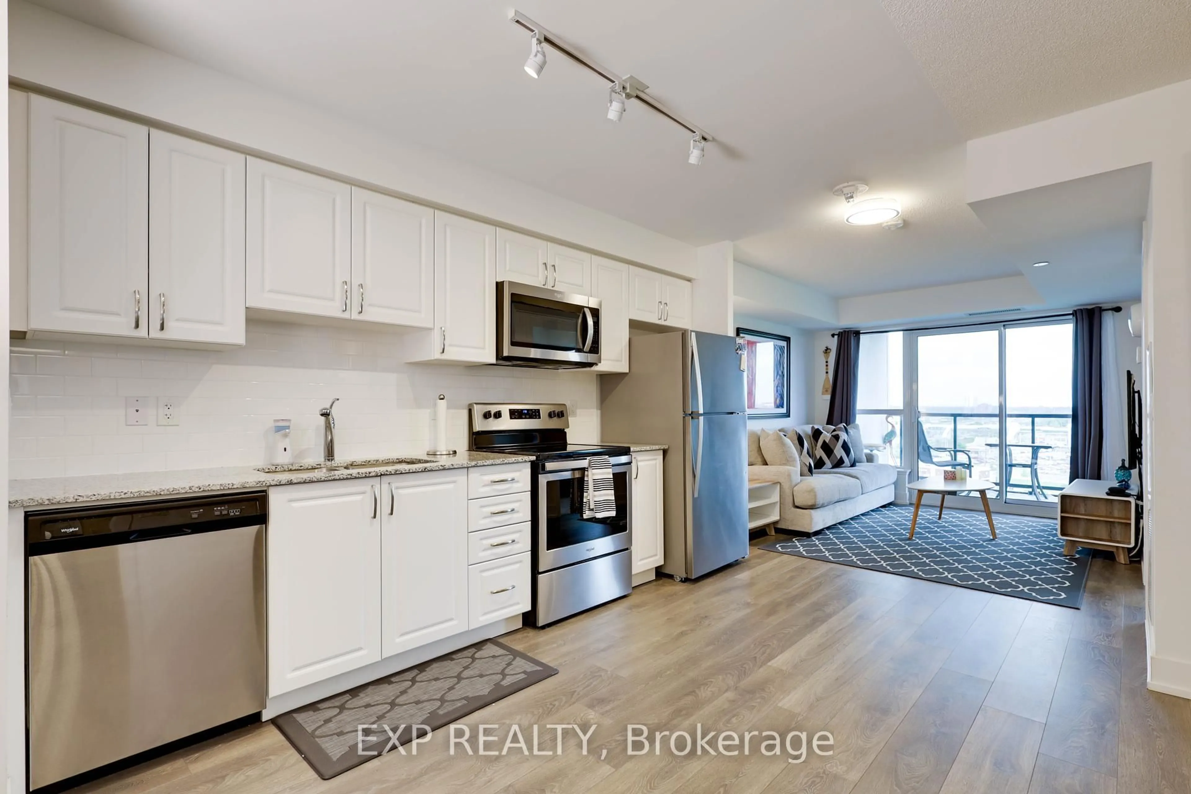Open concept kitchen, wood/laminate floor for 1255 Bayly St #1003, Pickering Ontario L1W 0B6