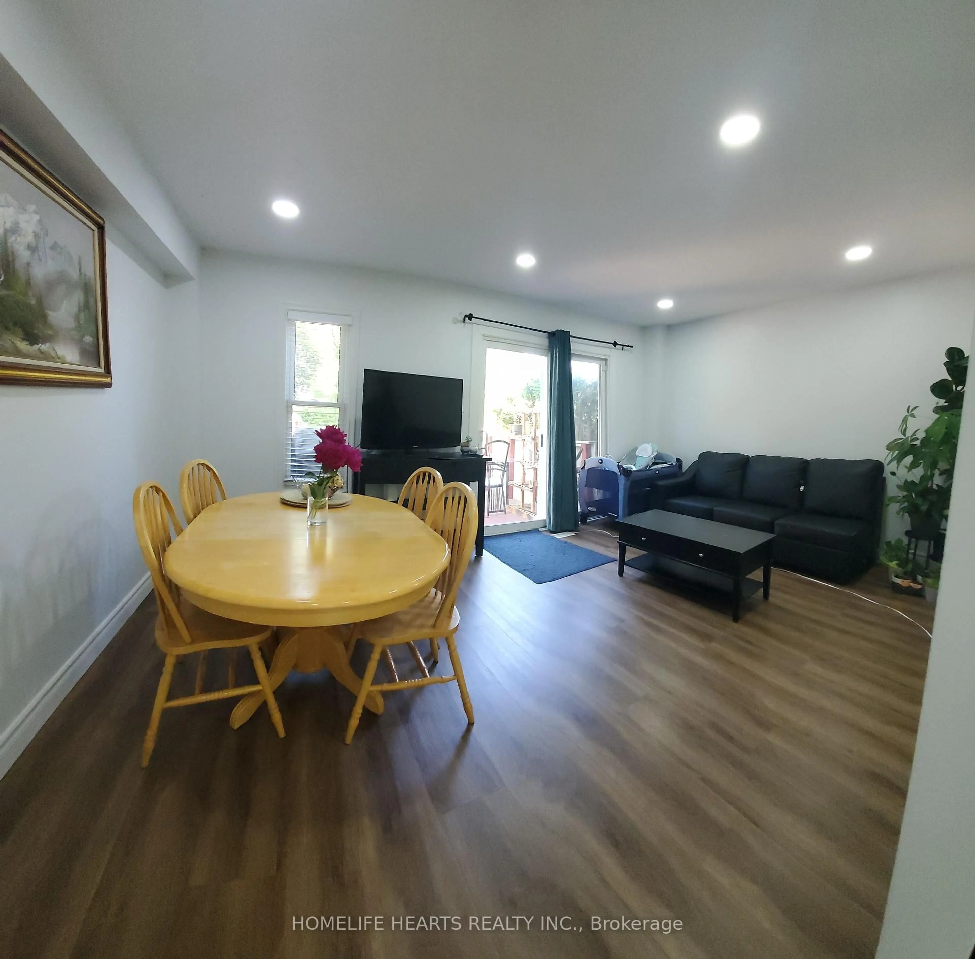 Living room with furniture, wood/laminate floor for 50 Silverbell Grve #21, Toronto Ontario M1B 2L7