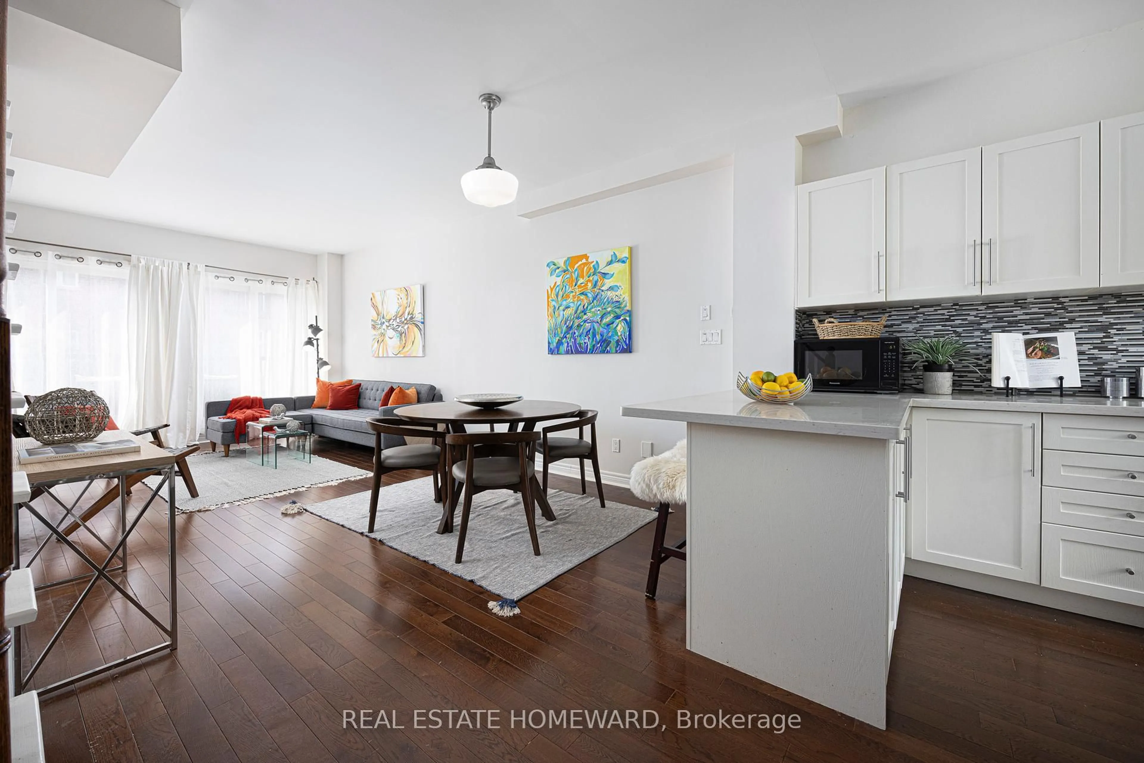 Open concept kitchen, wood/laminate floor for 3773 St. Clair Ave, Toronto Ontario M1M 1V1