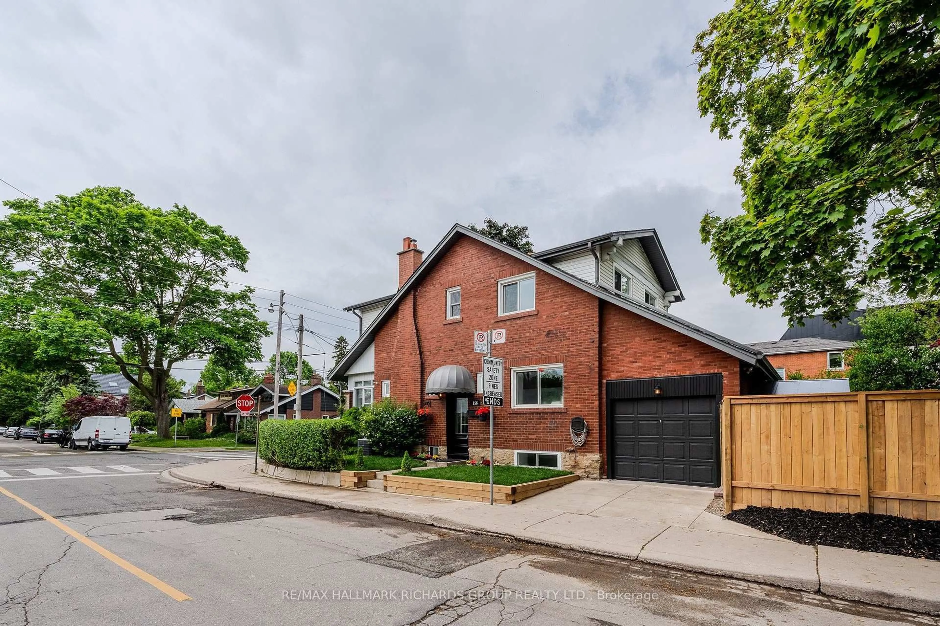 Home with brick exterior material, street for 156 Eastwood Rd, Toronto Ontario M4L 2C9