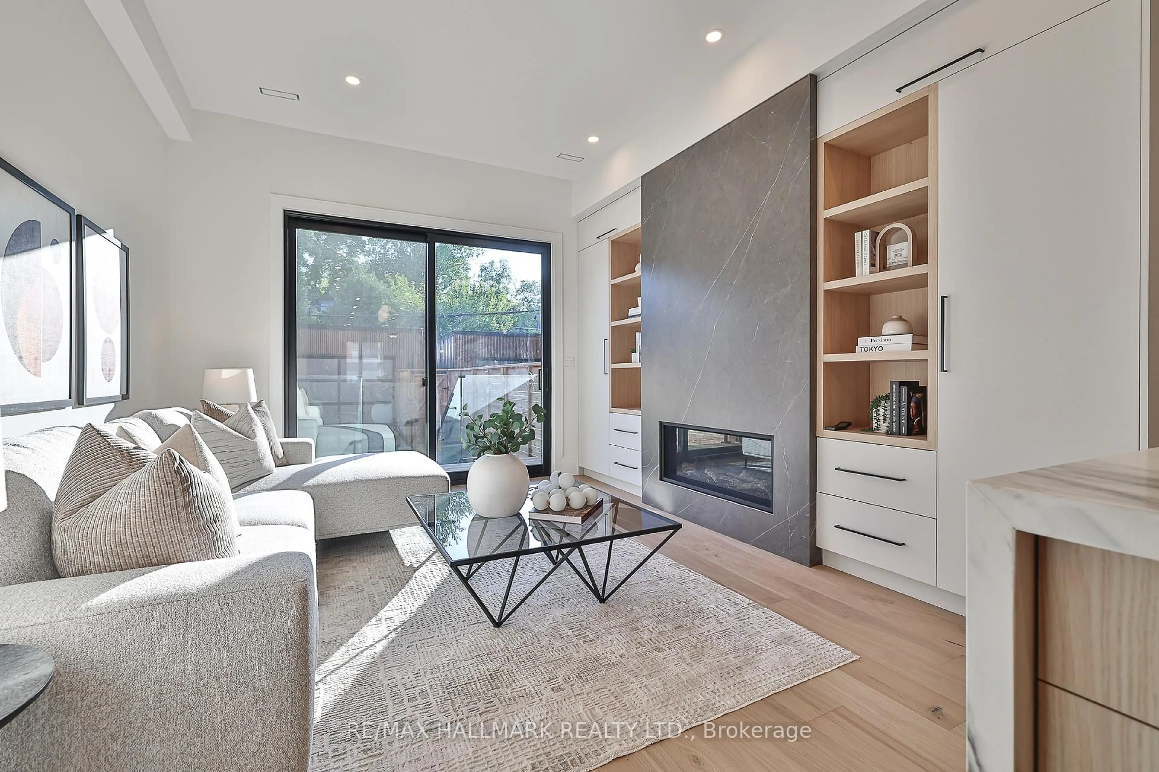 Living room with furniture, wood/laminate floor for 46A Pape Ave, Toronto Ontario M4M 2V6