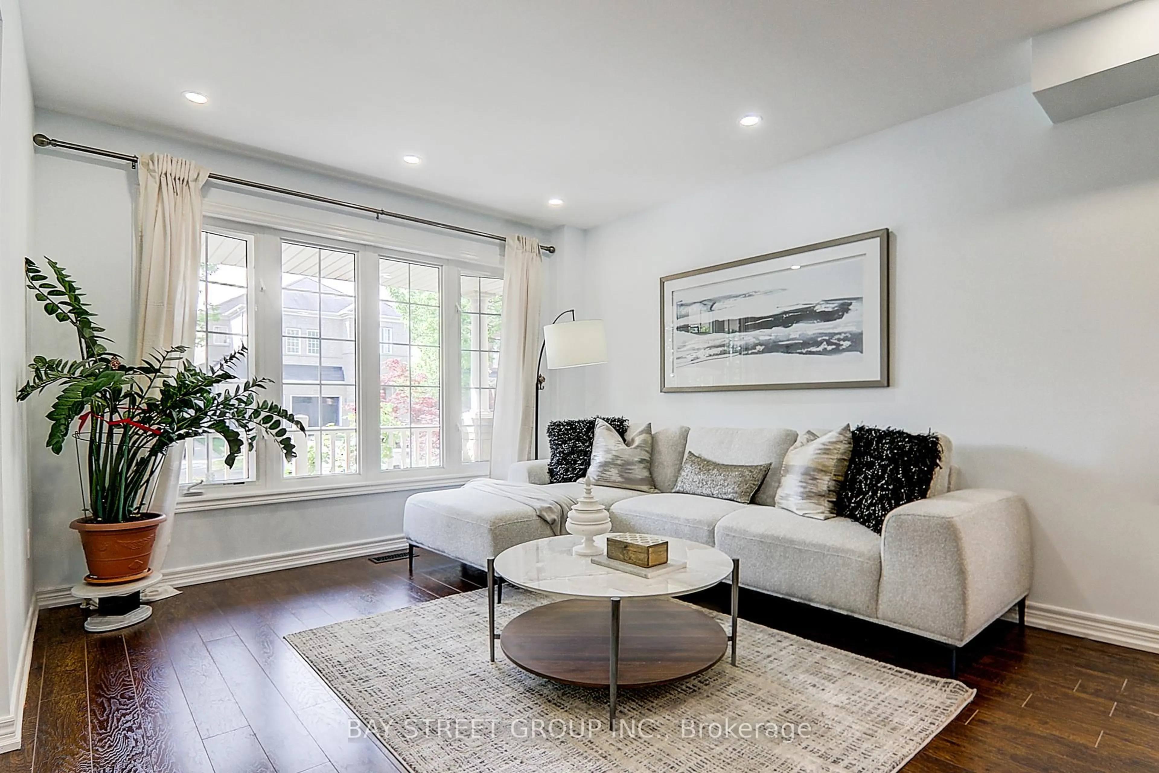 Living room with furniture, wood/laminate floor for 66 Howlett Cres, Ajax Ontario L1T 0A6