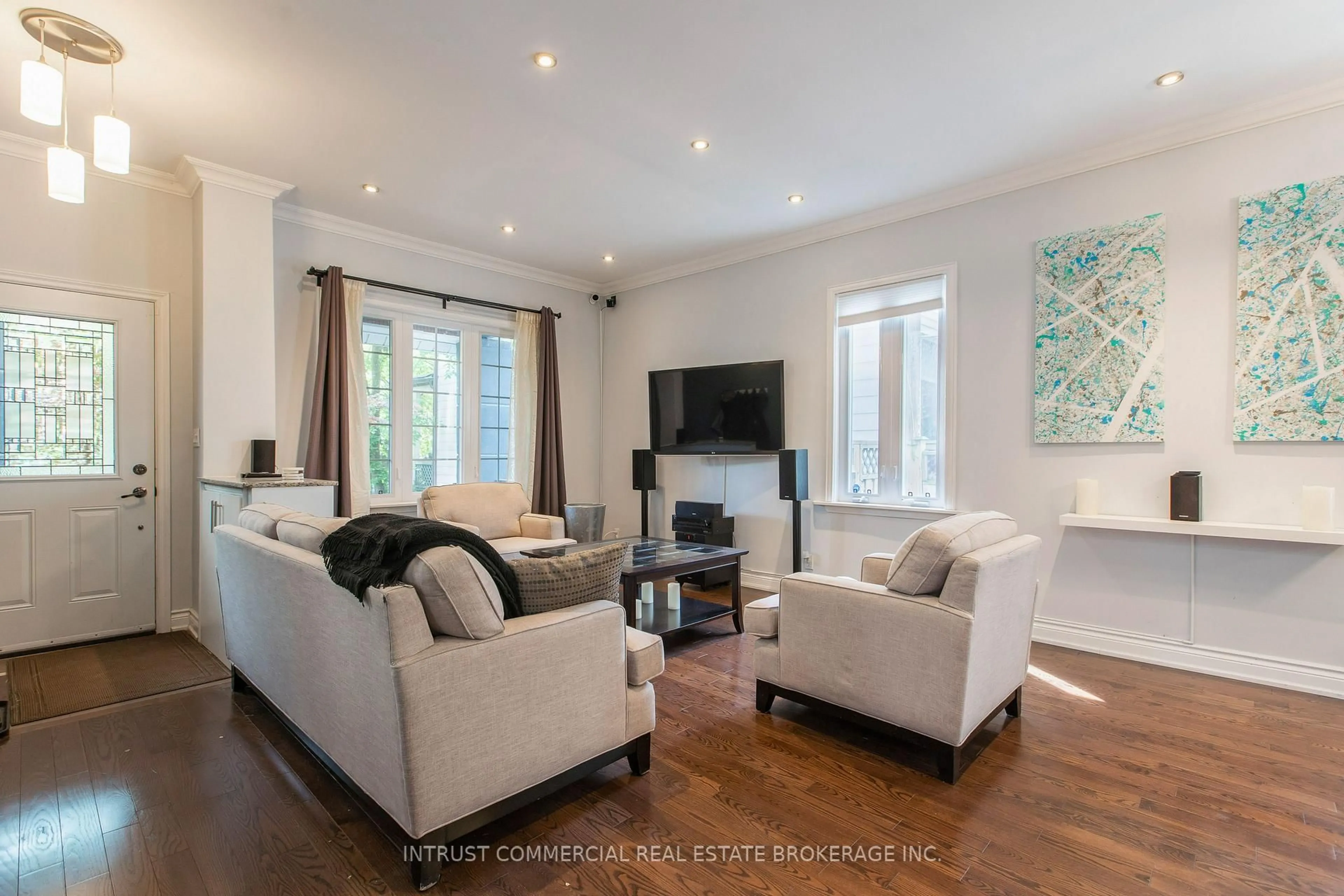 Living room with furniture, wood/laminate floor for 398 Leslie St, Toronto Ontario M4M 3E4