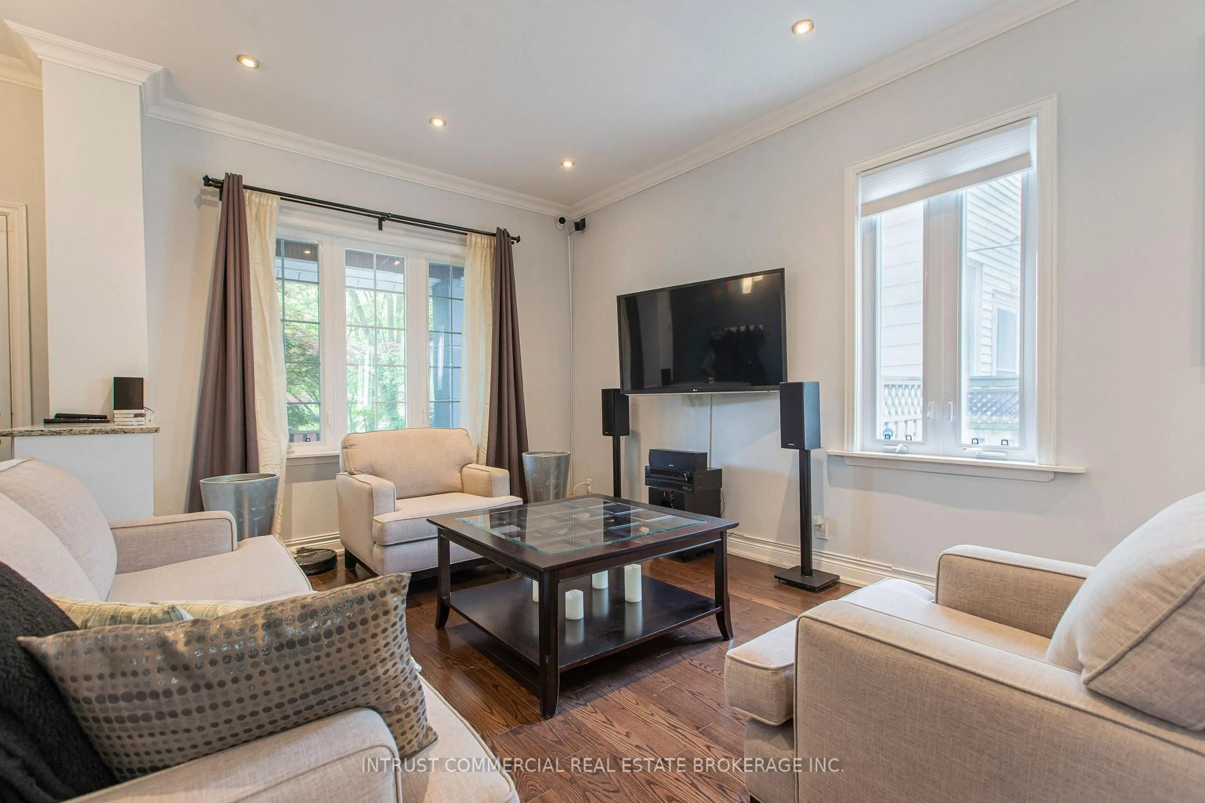 Living room with furniture, wood/laminate floor for 398 Leslie St, Toronto Ontario M4M 3E4
