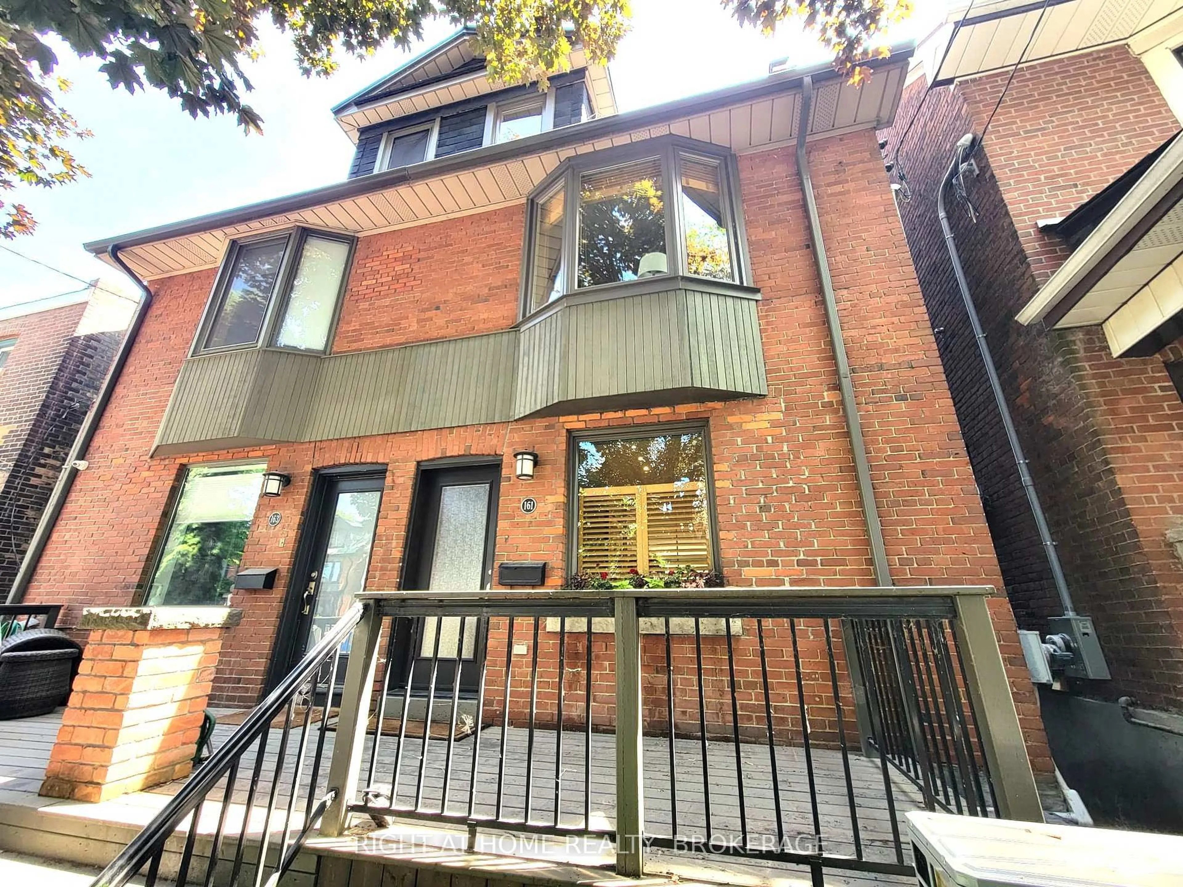 Home with brick exterior material, street for 161 Langley Ave, Toronto Ontario M4K 1B8