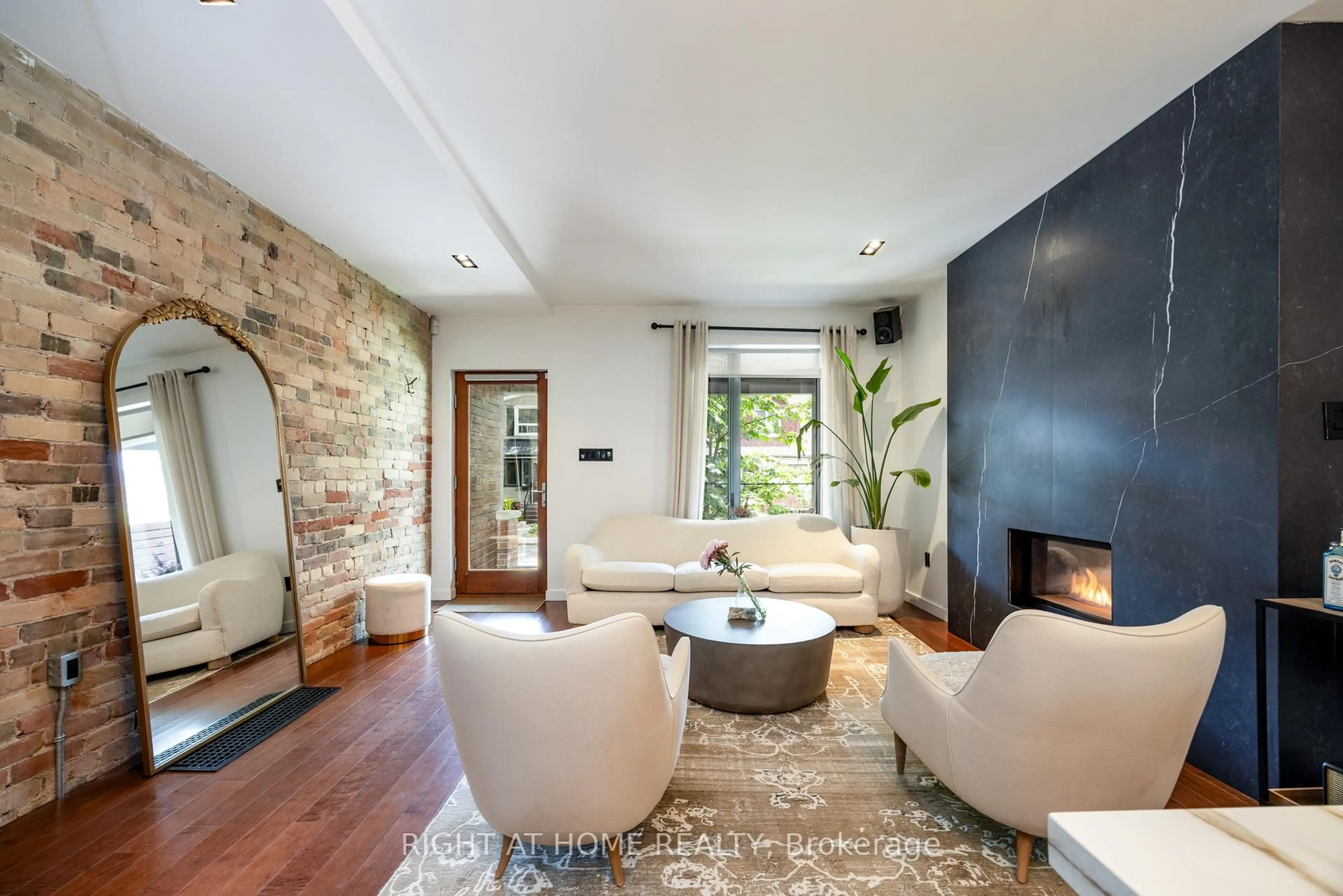 Living room with furniture, ceramic/tile floor for 128 Booth Ave, Toronto Ontario M4M 2M4