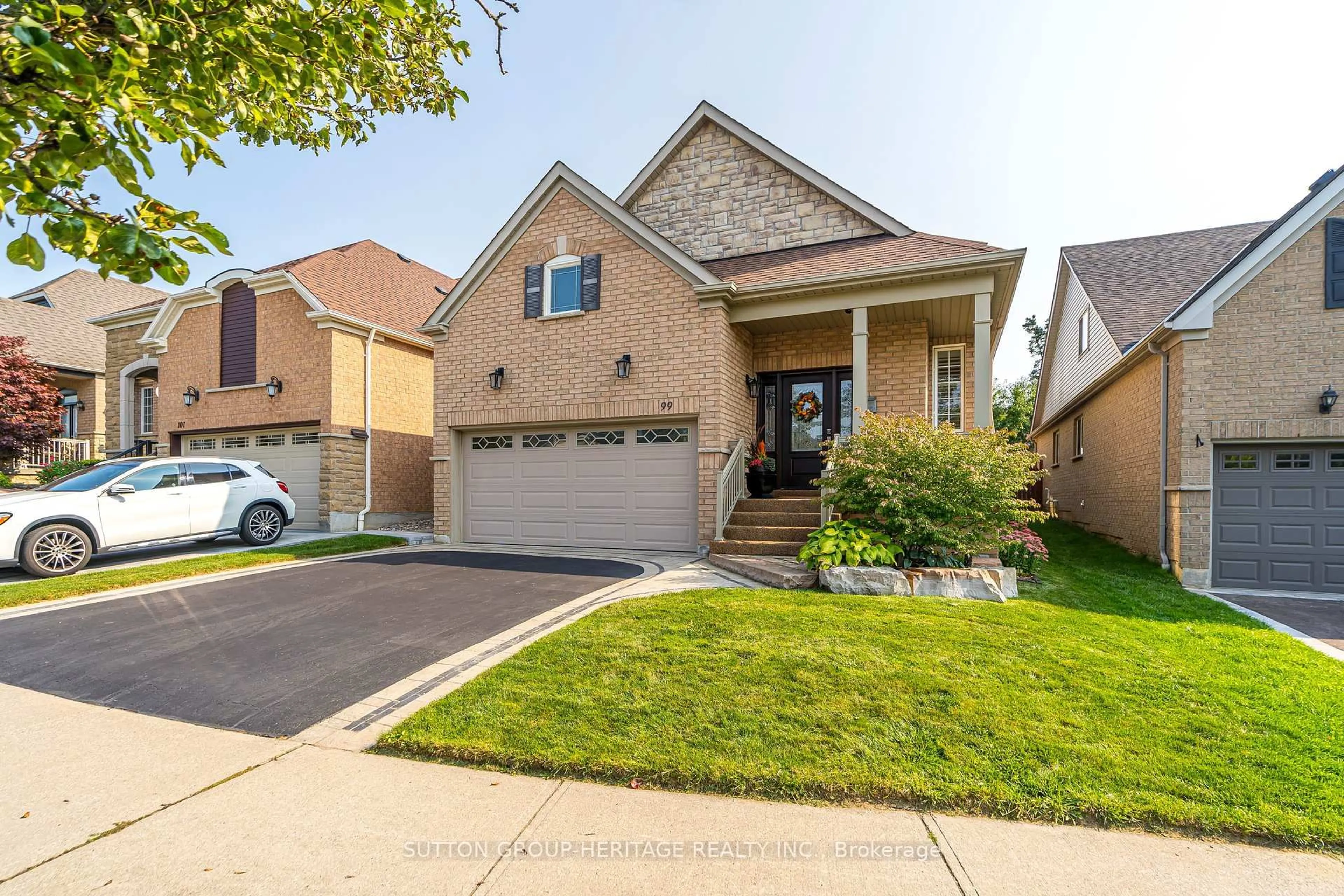 Home with brick exterior material, street for 99 Mackey Dr, Whitby Ontario L1P 1R5