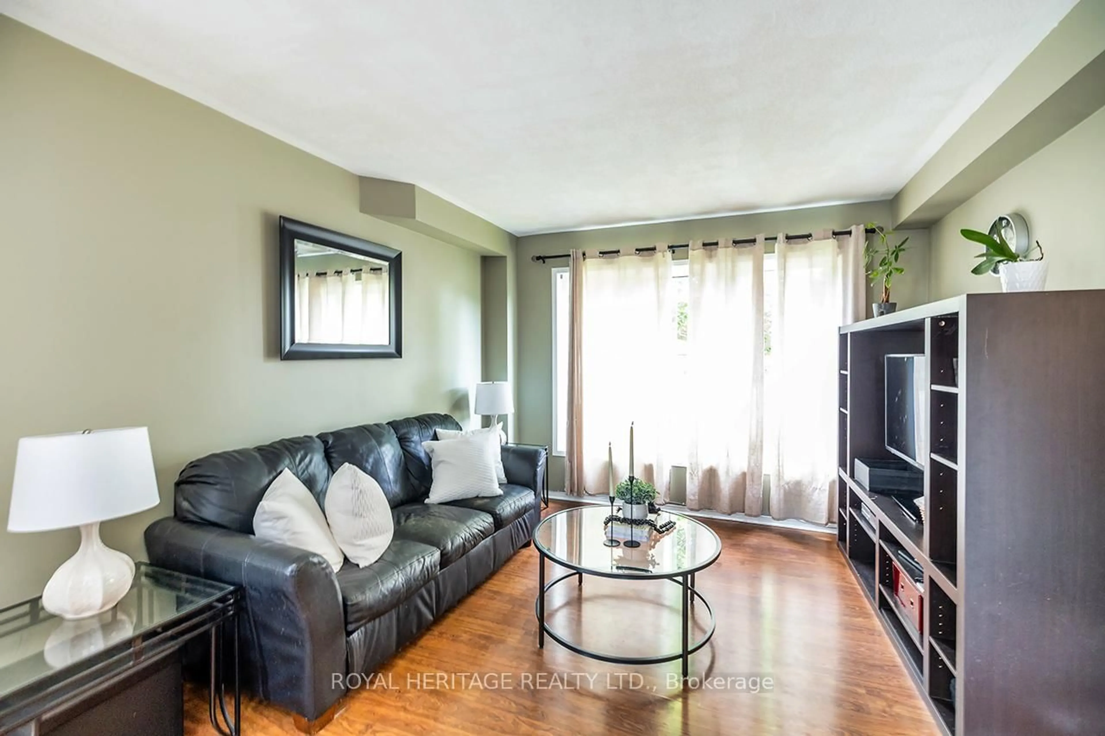 Living room with furniture, wood/laminate floor for 15 Merryfield Crt, Clarington Ontario L1C 4L2