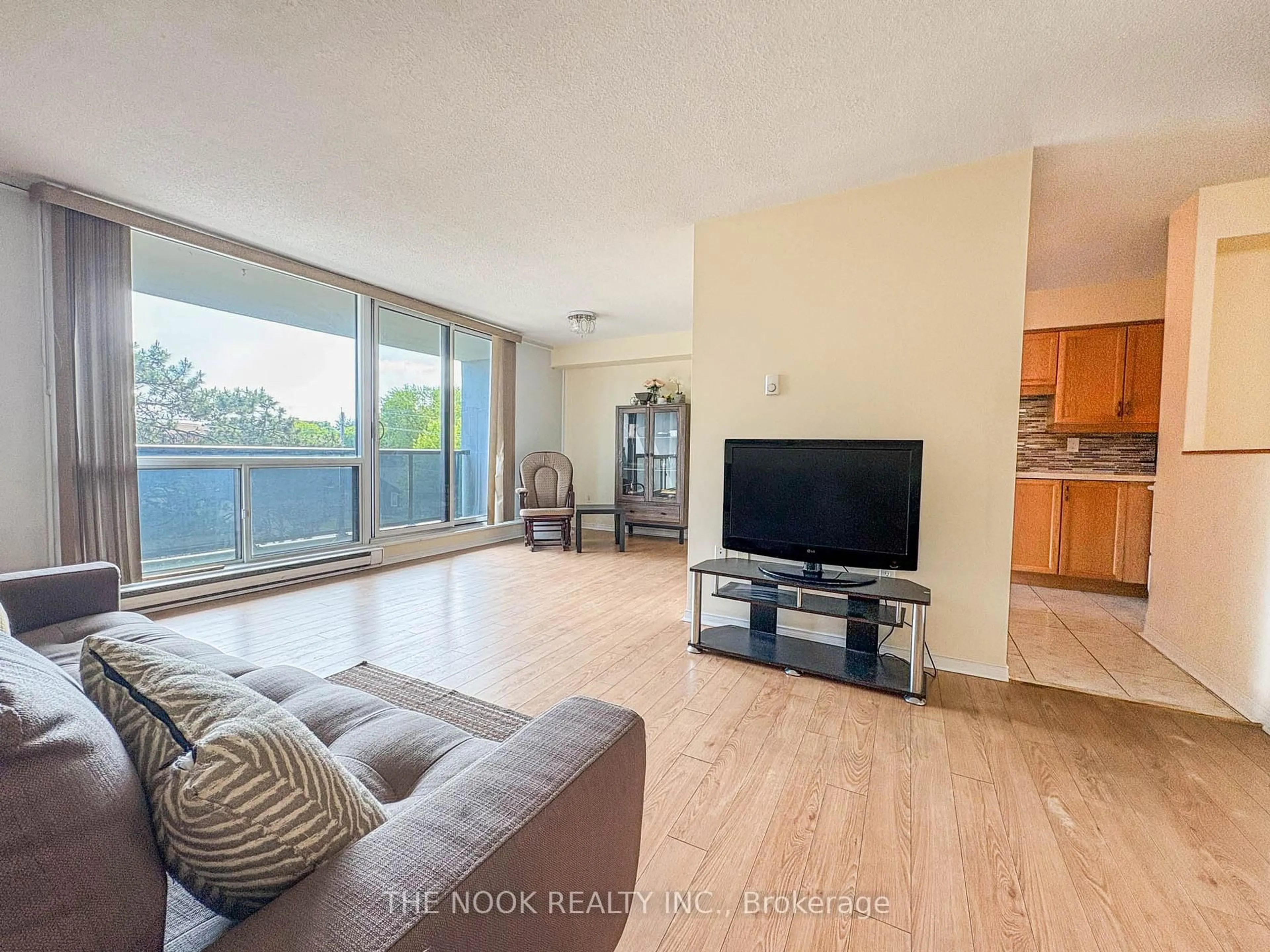 Living room with furniture, wood/laminate floor for 454 Centre St #406, Oshawa Ontario L1H 4C2
