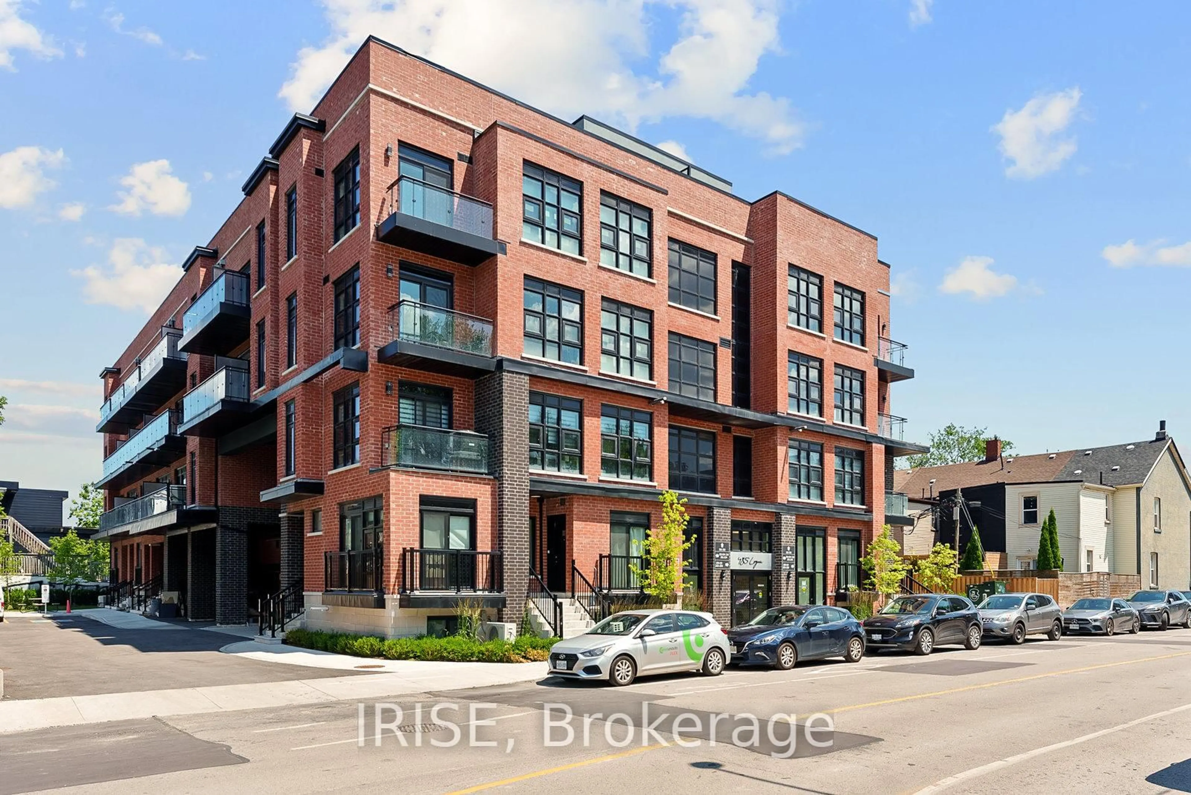 Home with brick exterior material, street for 485 Logan Ave #202, Toronto Ontario M4M 2P5