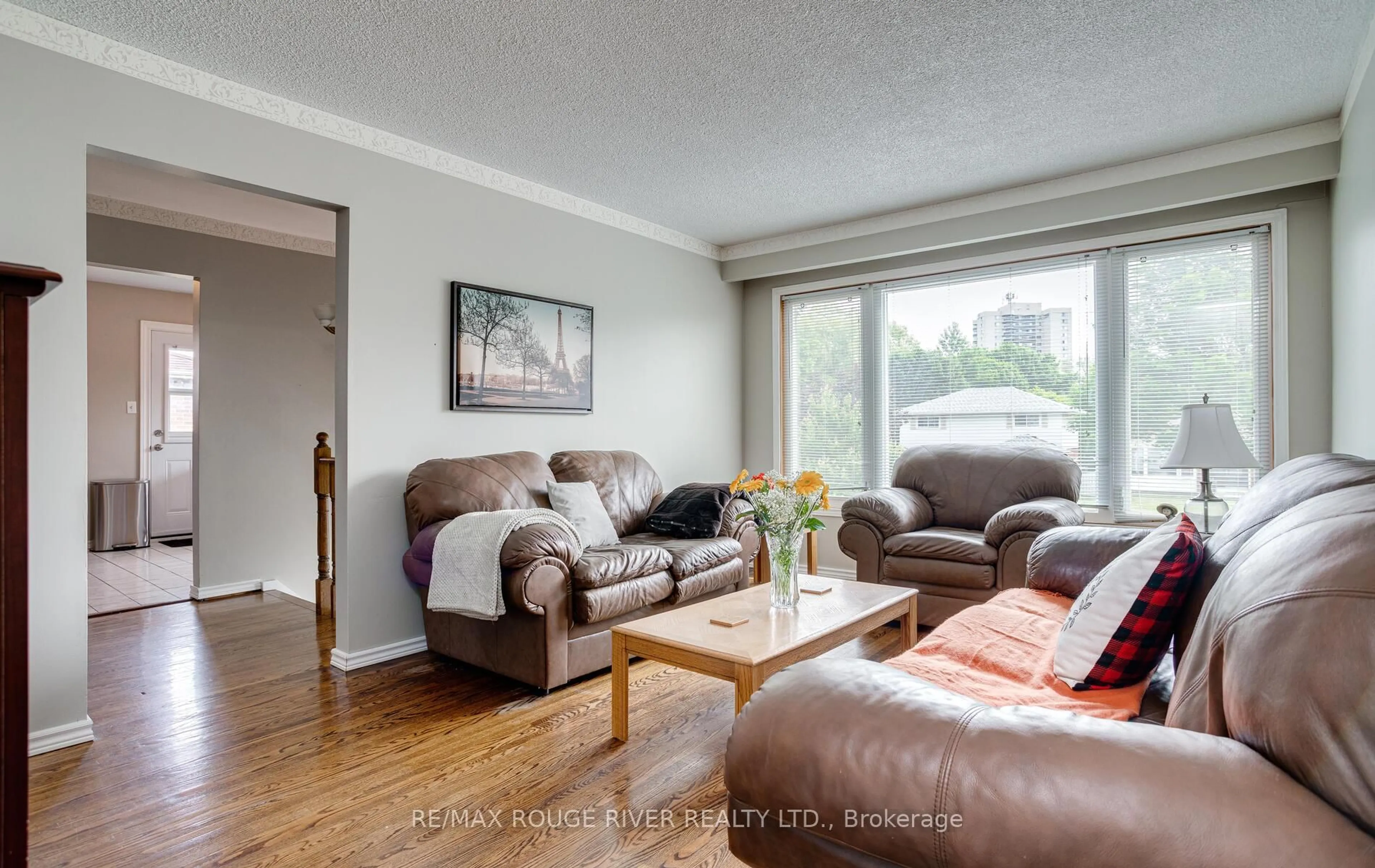 Living room with furniture, wood/laminate floor for 690 Central Park Blvd, Oshawa Ontario L1G 6A9