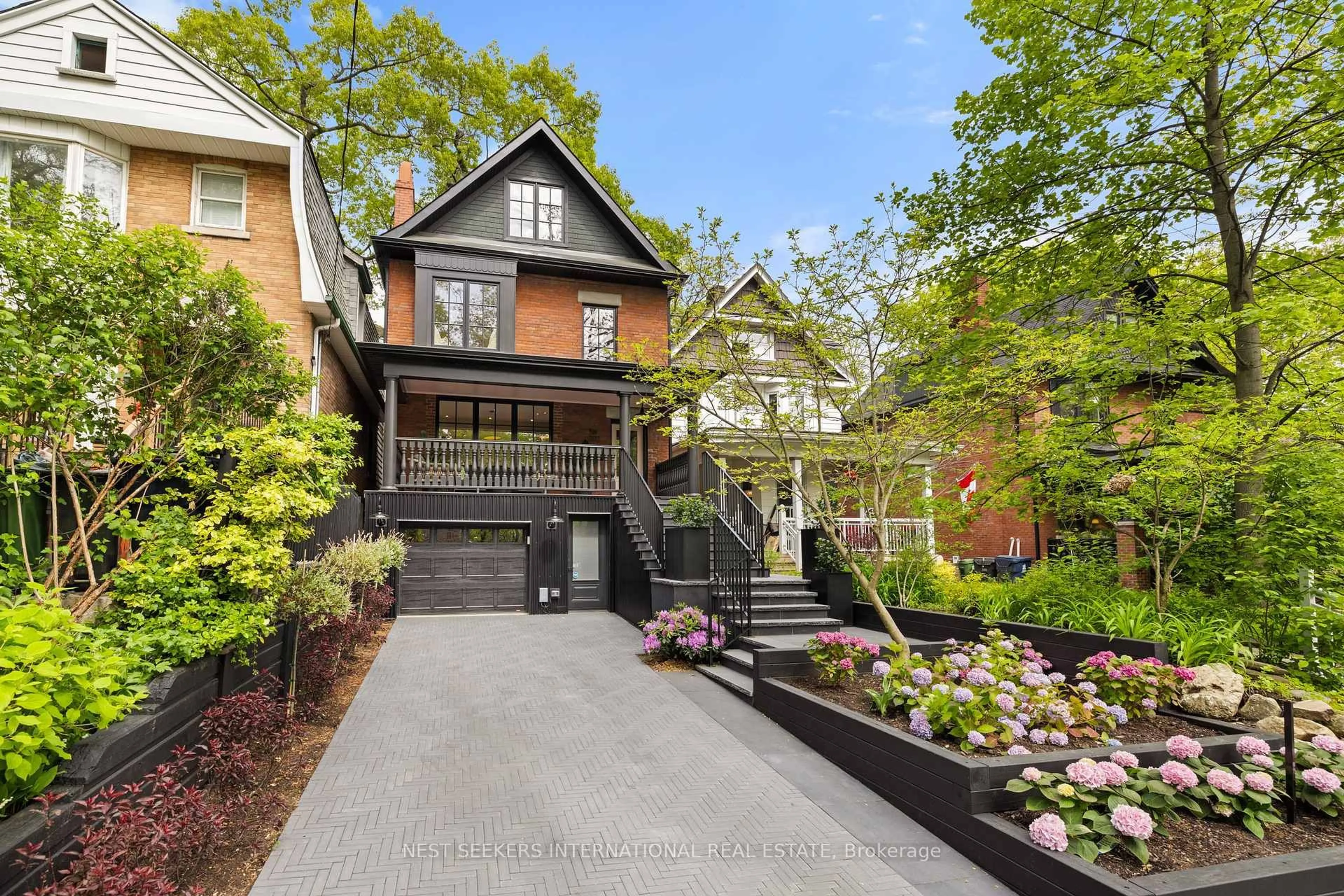 Home with brick exterior material, street for 203 Willow Ave, Toronto Ontario M4E 3K4