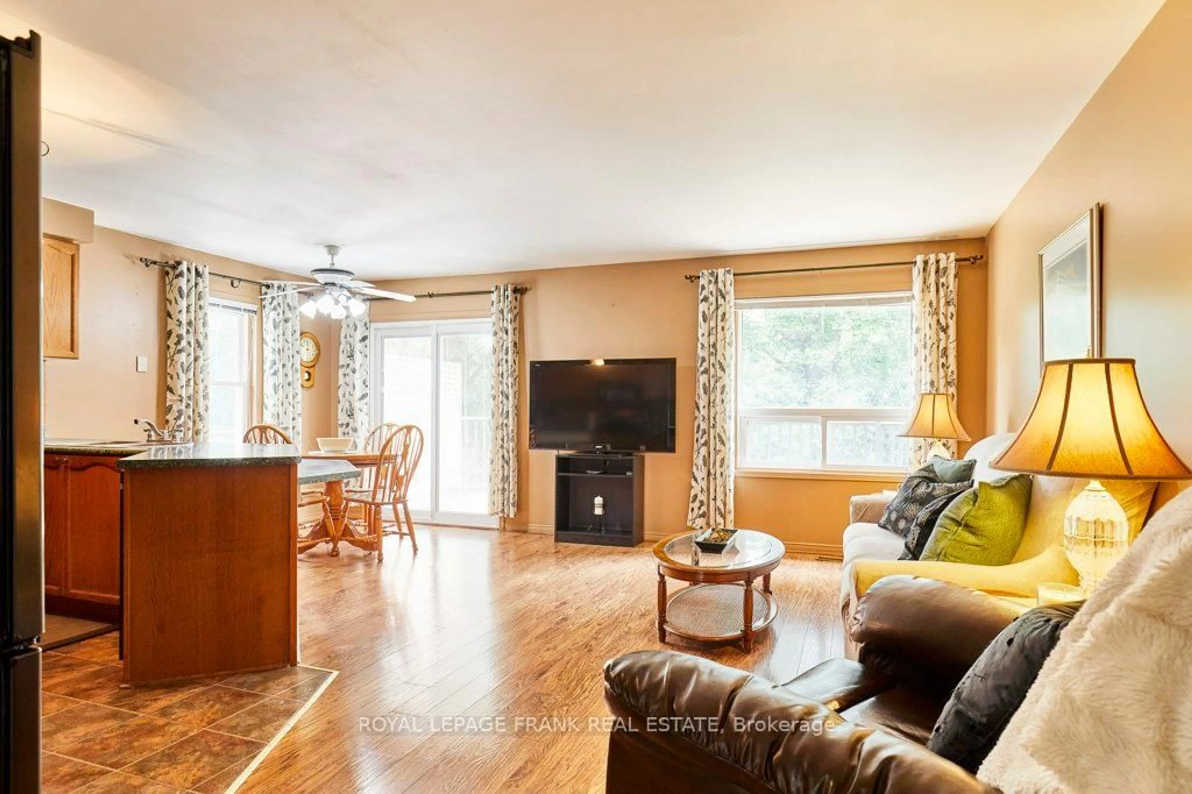 Living room with furniture, wood/laminate floor for 1775 Edenwood Dr, Oshawa Ontario L1G 7Y3