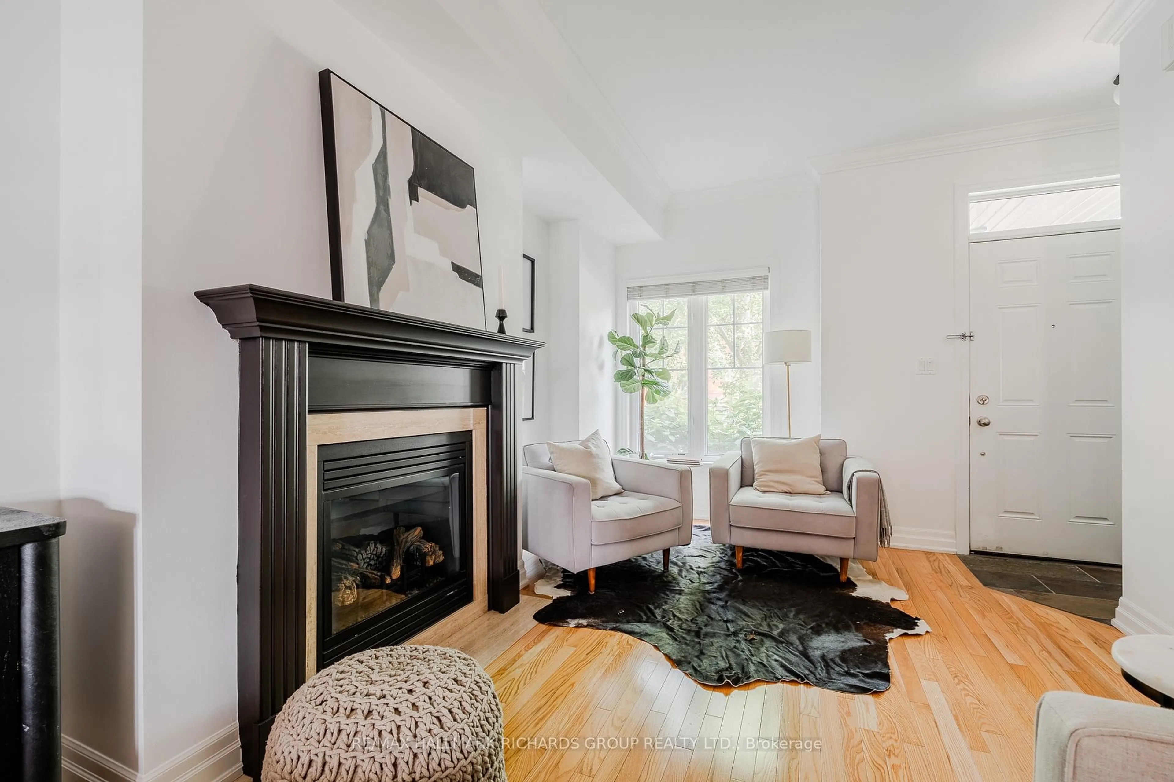 Living room with furniture, wood/laminate floor for 213 First Ave, Toronto Ontario M4M 1X5