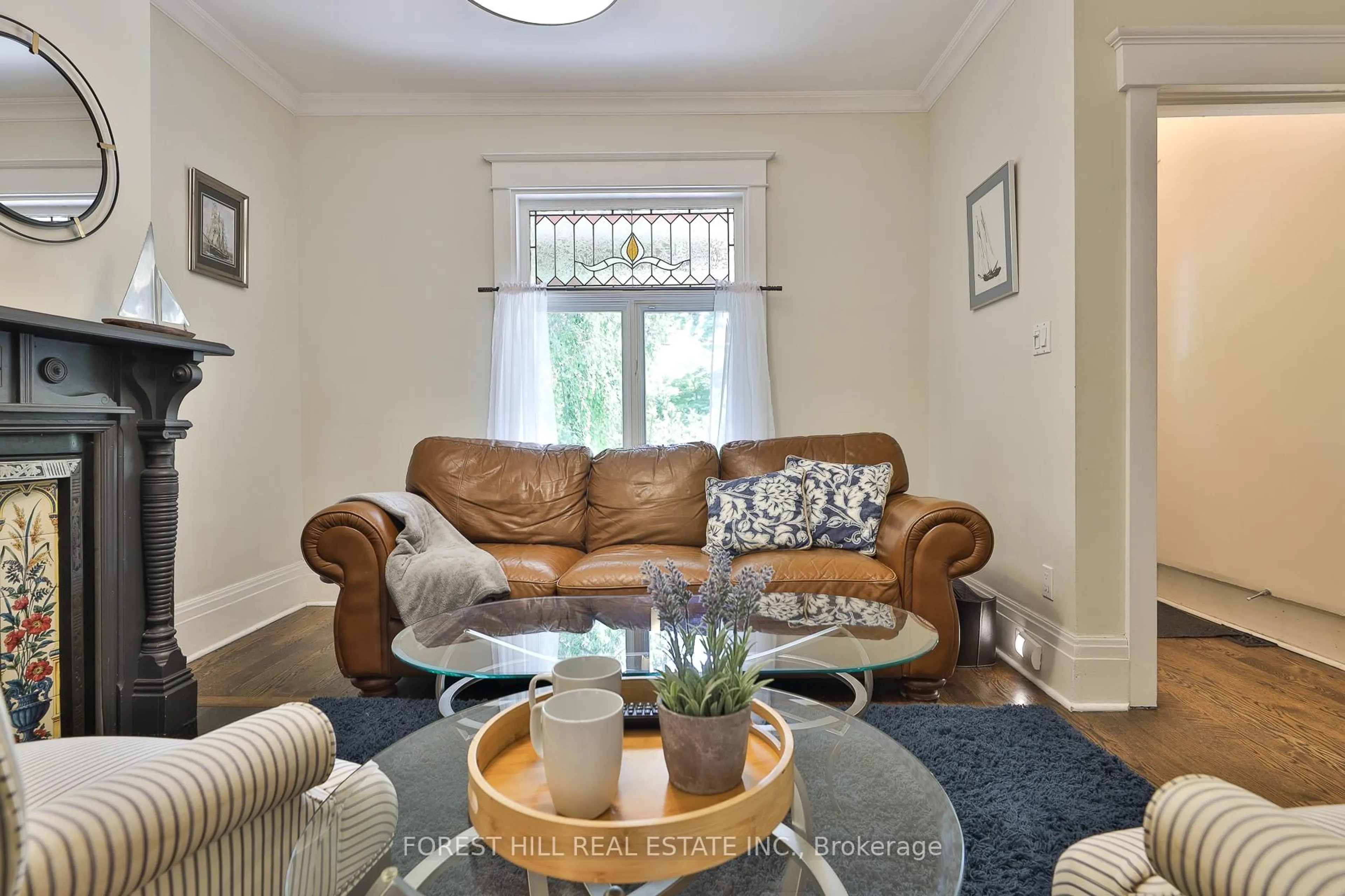 Living room with furniture, wood/laminate floor for 76 Sparkhall Ave, Toronto Ontario M4K 1G6
