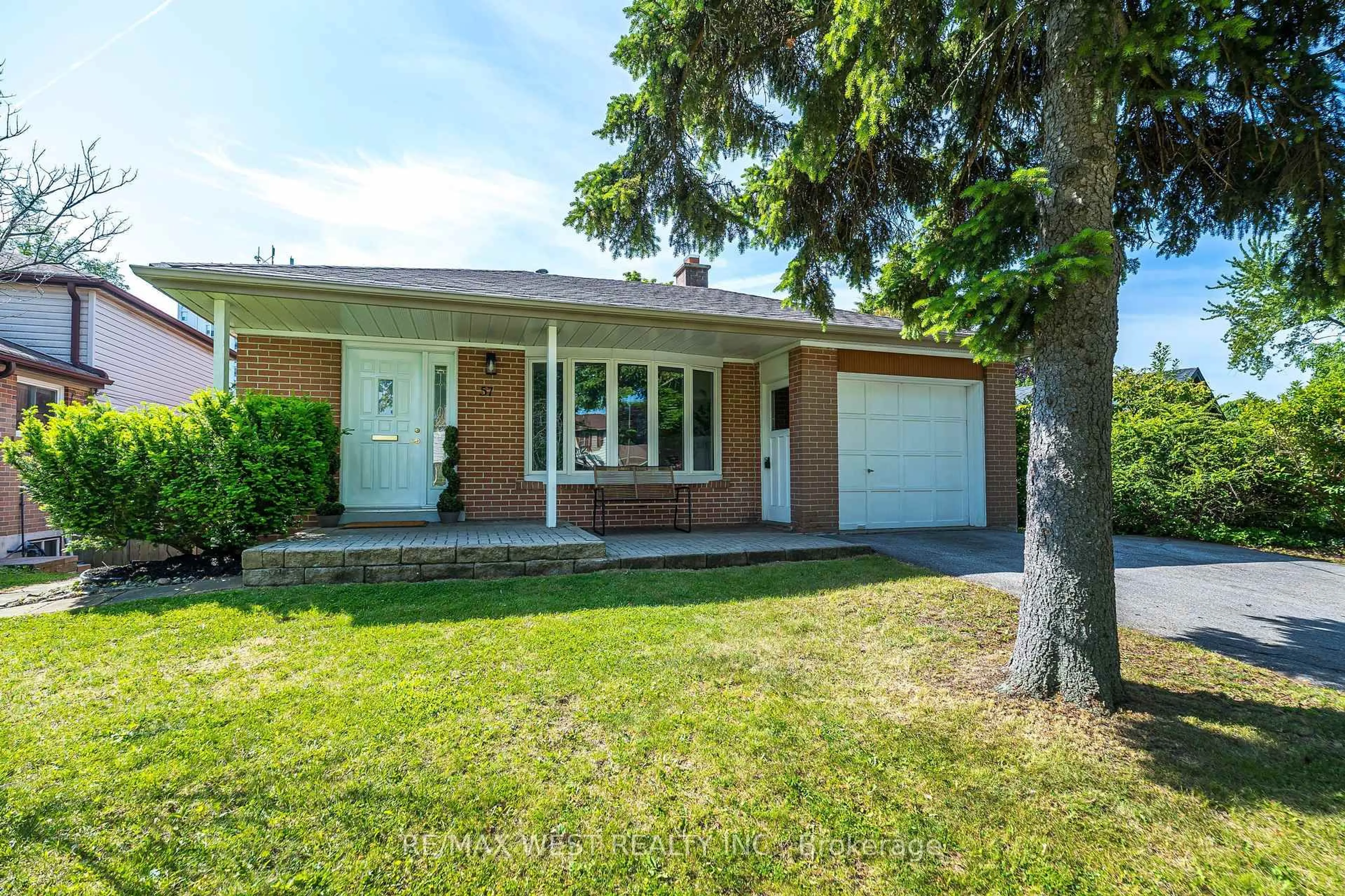 Home with brick exterior material, street for 57 Bledlow Manor Dr, Toronto Ontario M1E 1B1