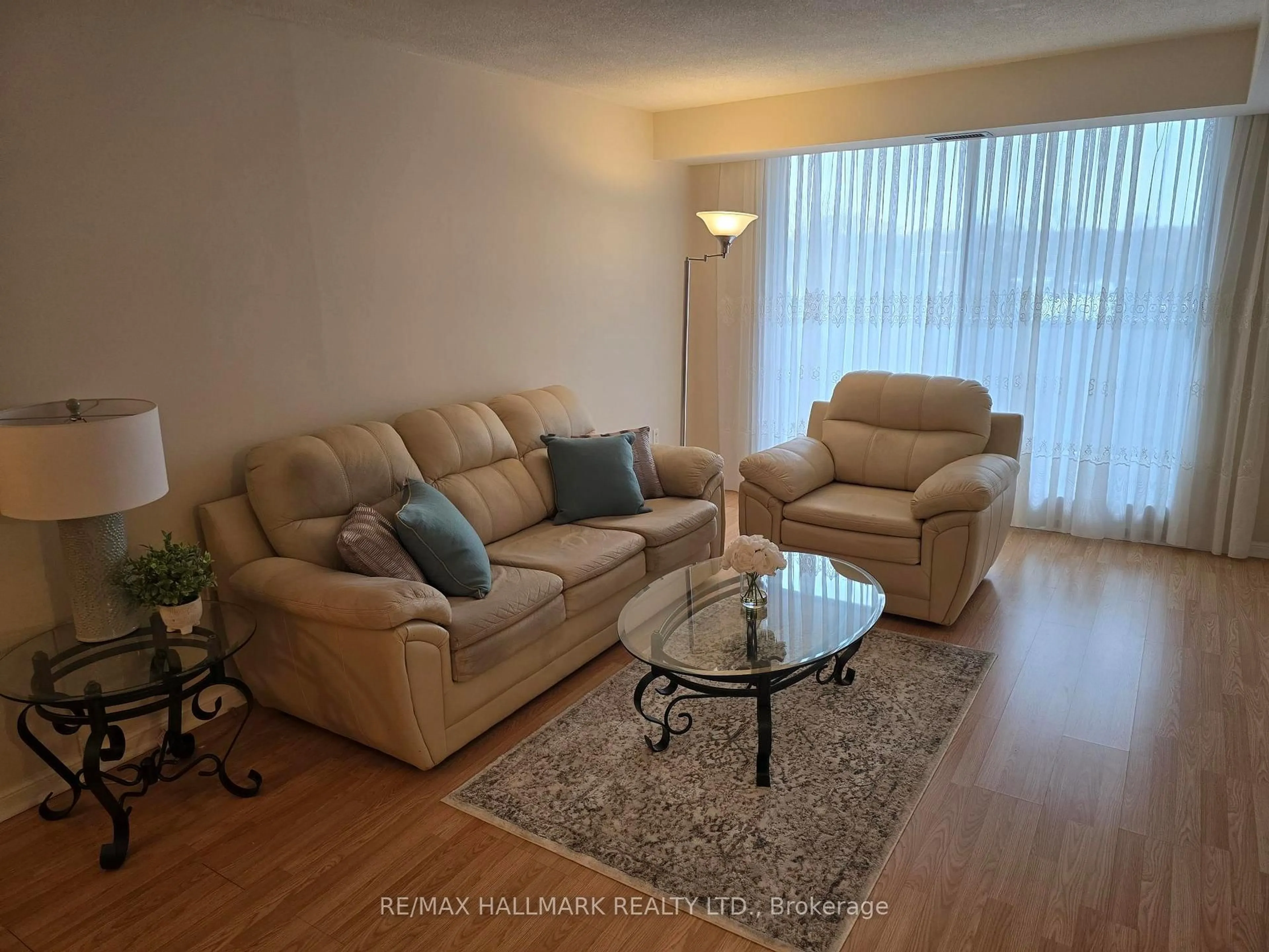 Living room with furniture, wood/laminate floor for 757 Victoria Park Ave #607, Toronto Ontario M4C 5N8