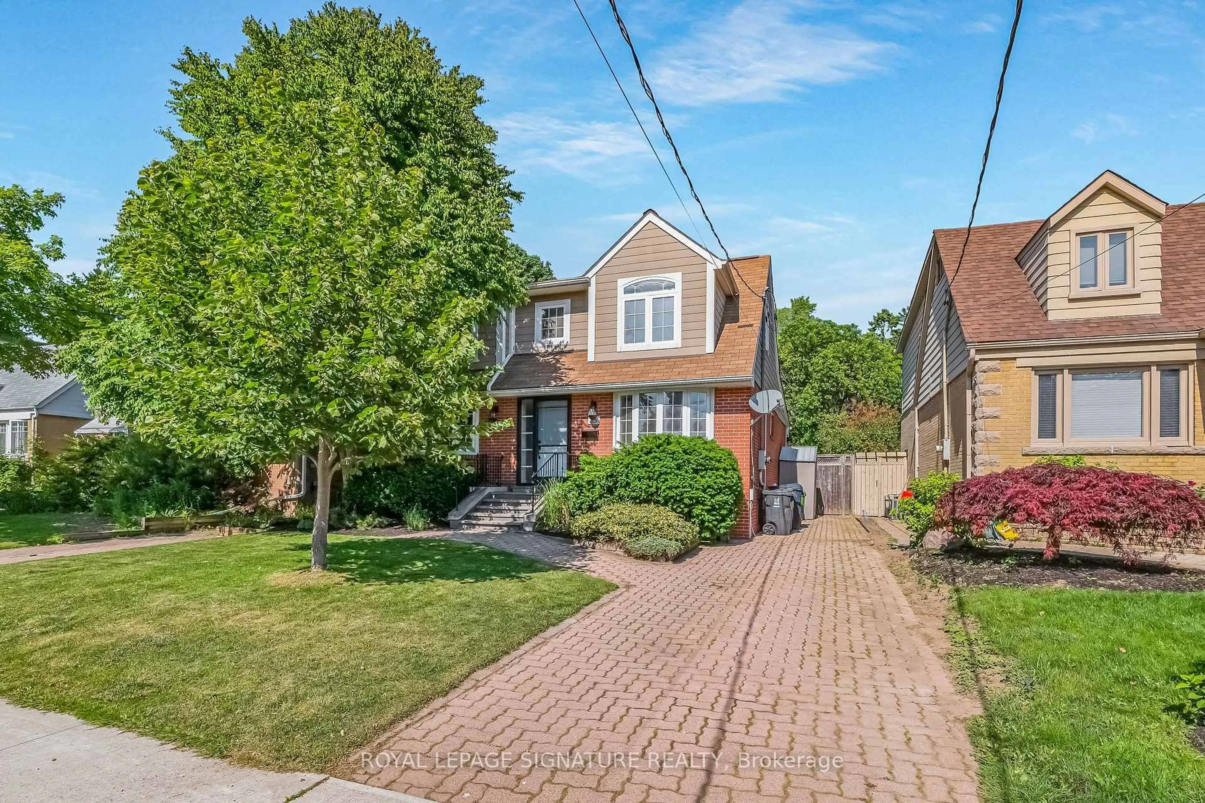 Home with brick exterior material, street for 15 Ashall Blvd, Toronto Ontario M4B 3C2