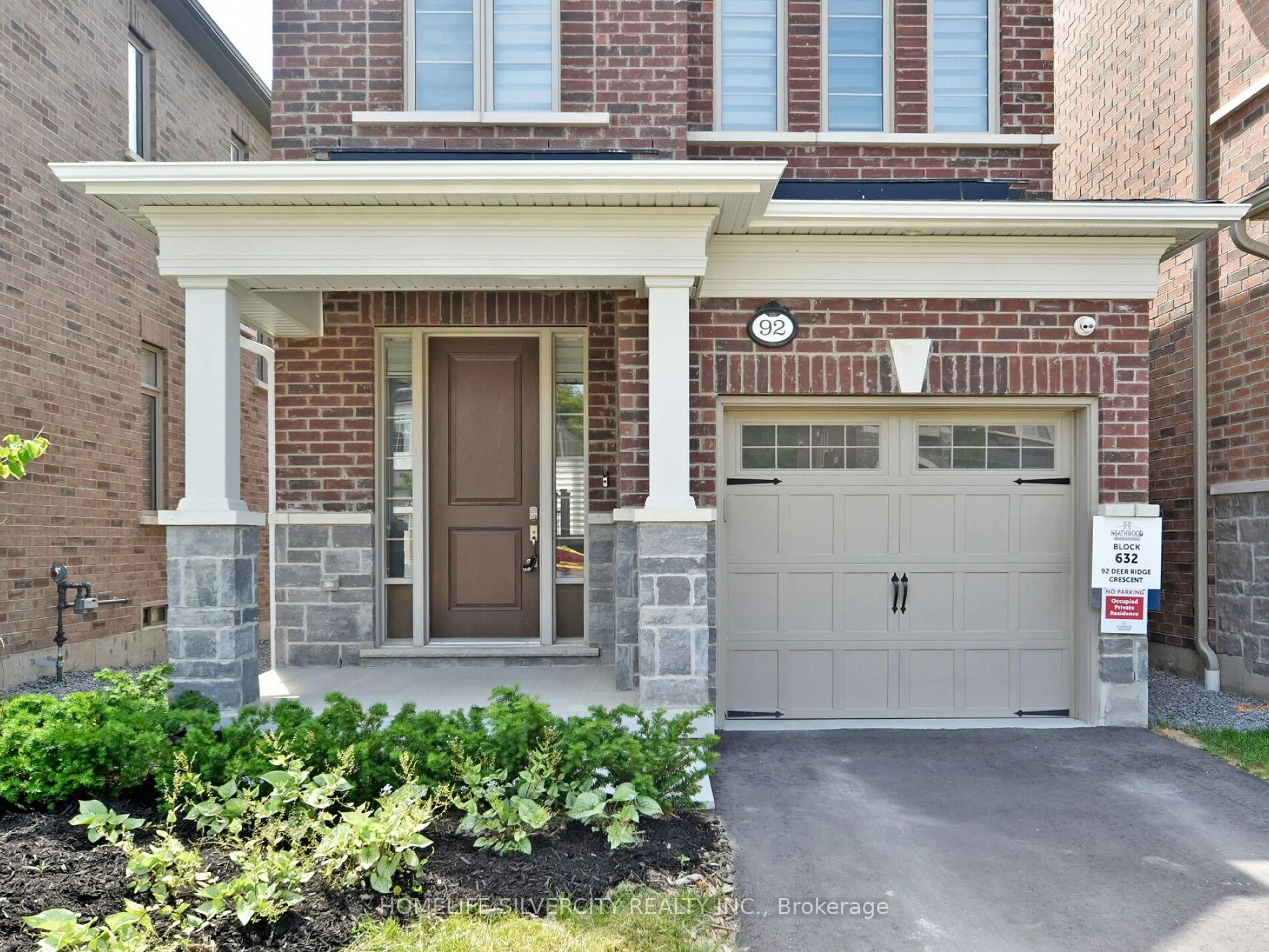 Home with brick exterior material, street for 92 Deer Ridge Cres, Whitby Ontario L1P 0P2