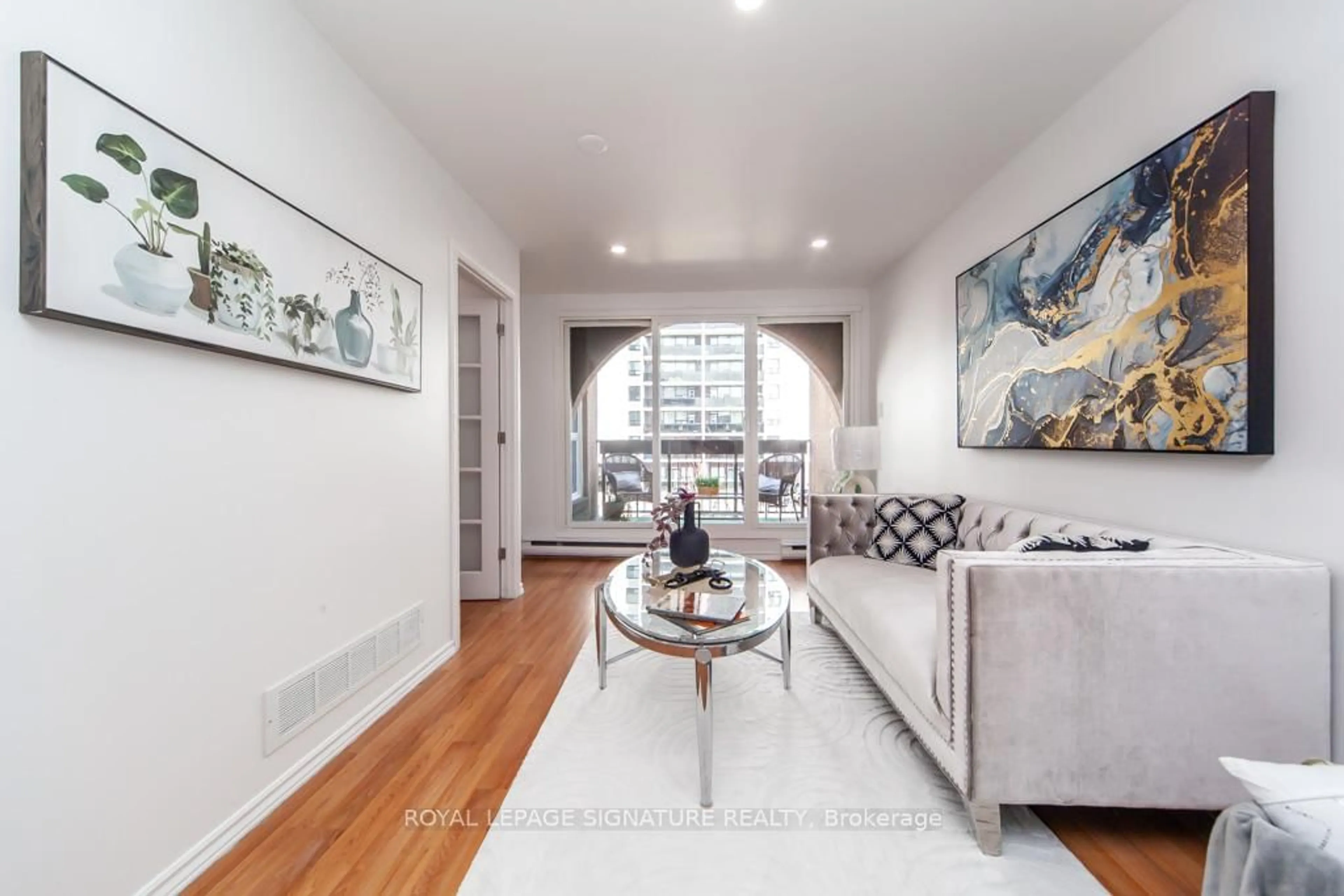 Living room with furniture, wood/laminate floor for 100 Mornelle Crt #2073, Toronto Ontario M1E 4X2