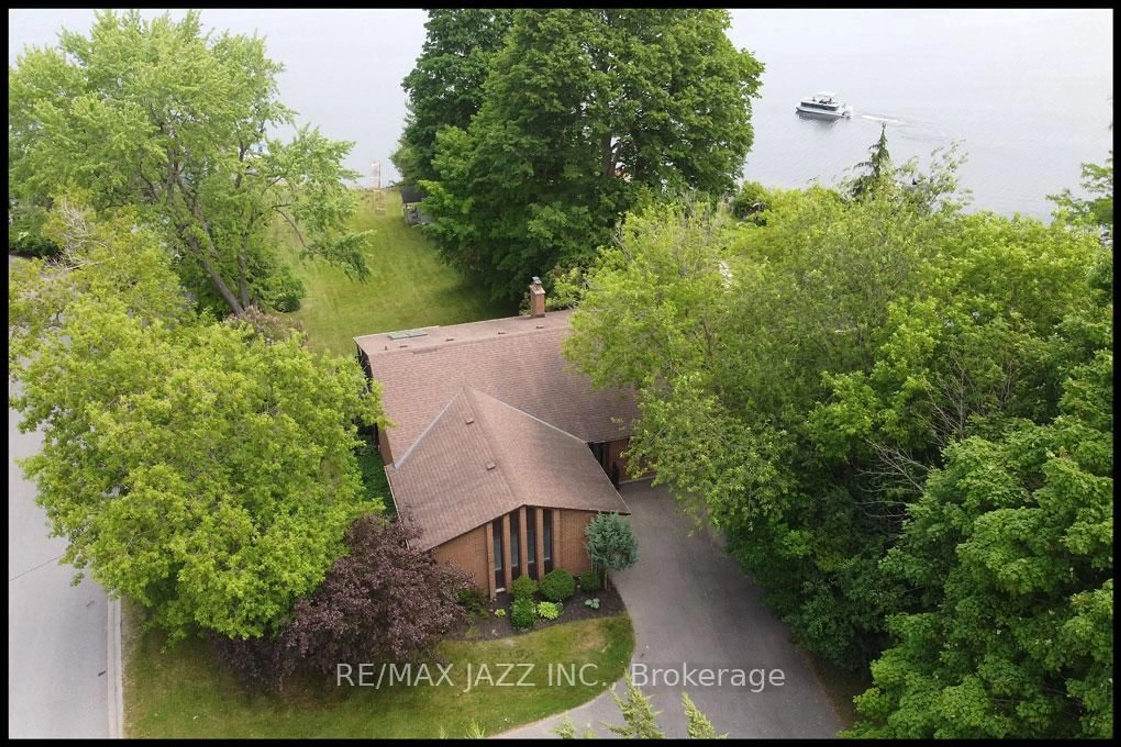 A pic from outside/outdoor area/front of a property/back of a property/a pic from drone, water/lake/river/ocean view for 447 Lakeshore Dr, Scugog Ontario L9L 1N7