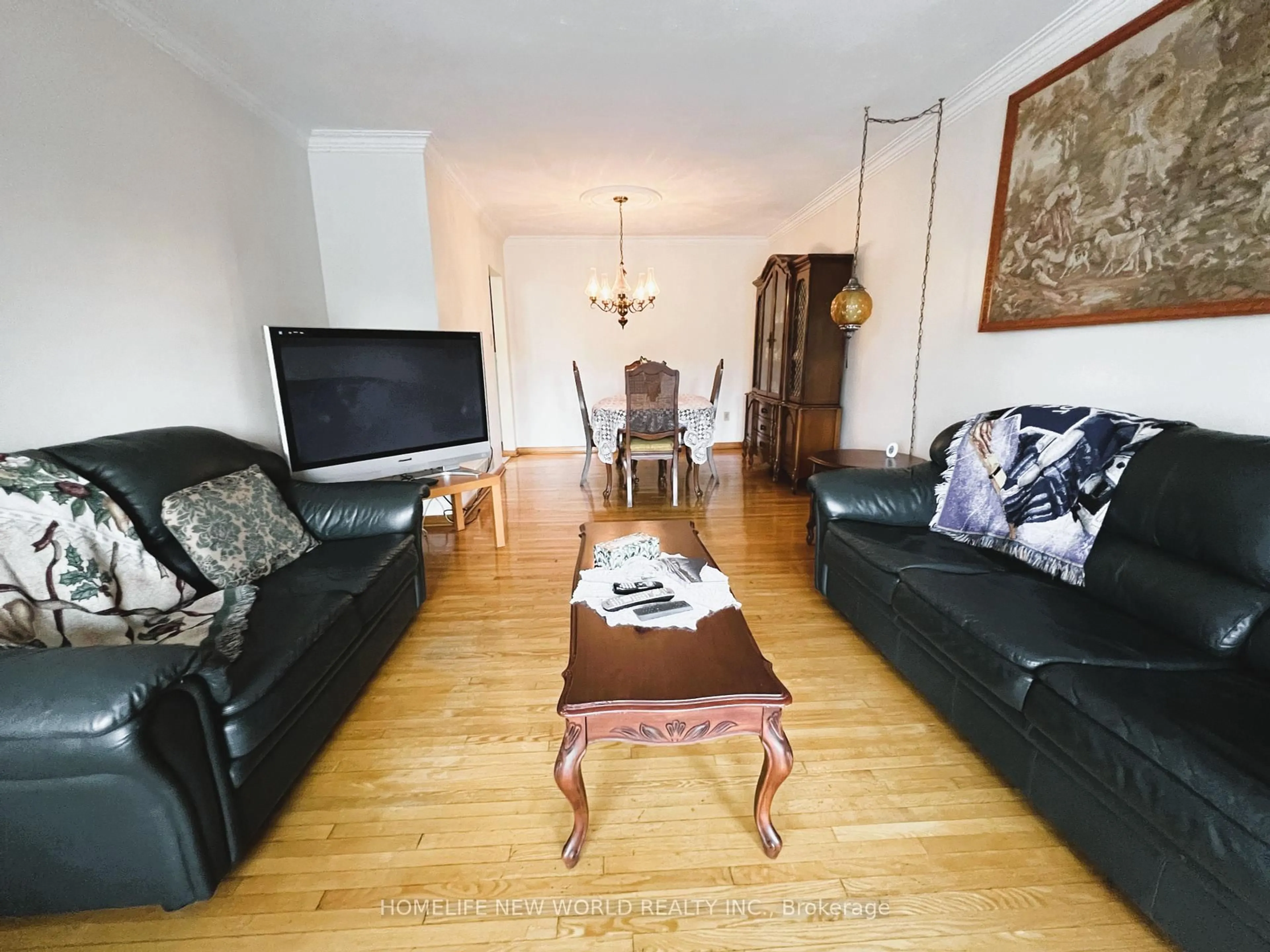 Living room with furniture, wood/laminate floor for 2A Fairglen Ave, Toronto Ontario M1T 1G7
