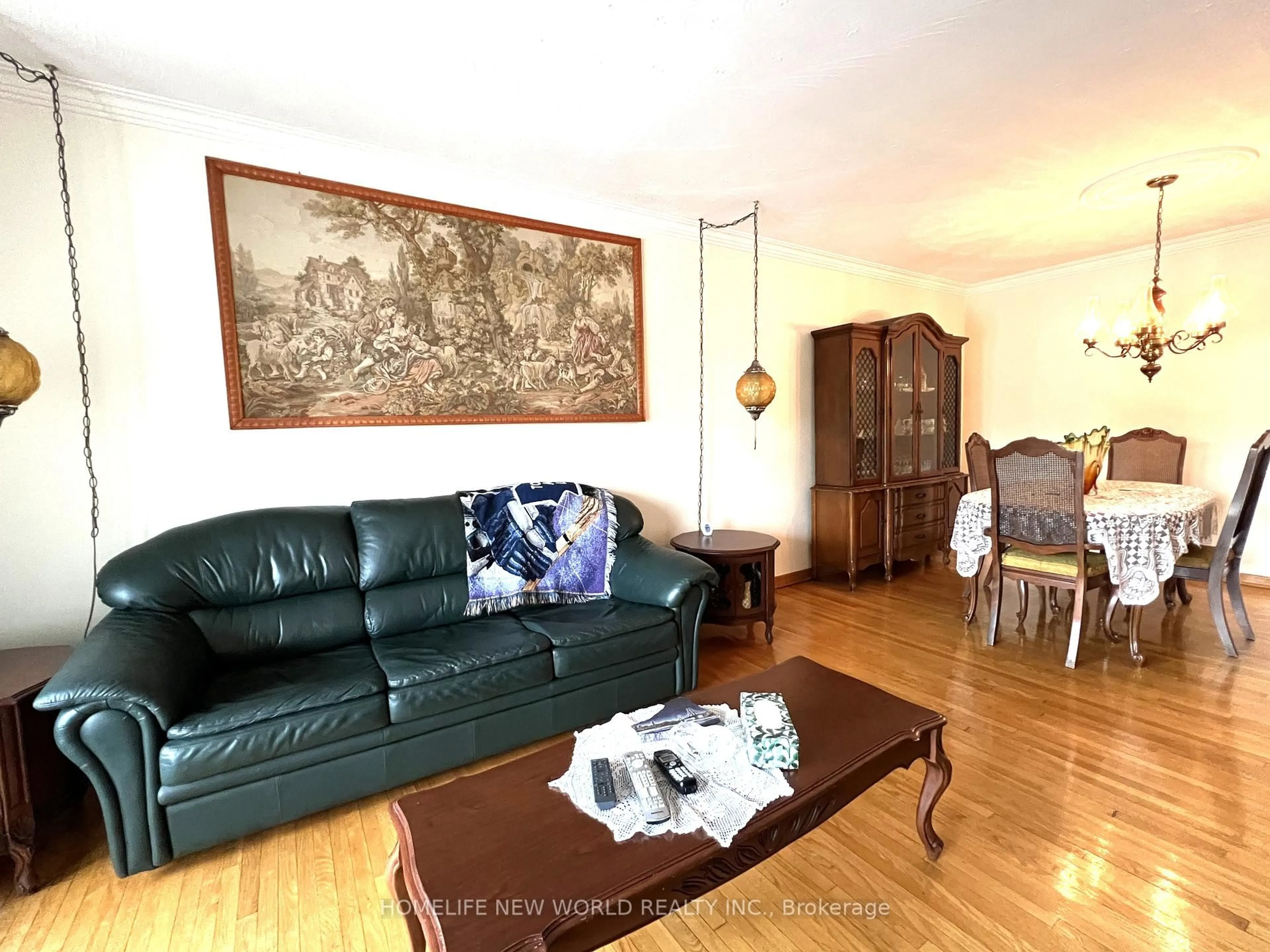 Living room with furniture, wood/laminate floor for 2A Fairglen Ave, Toronto Ontario M1T 1G7
