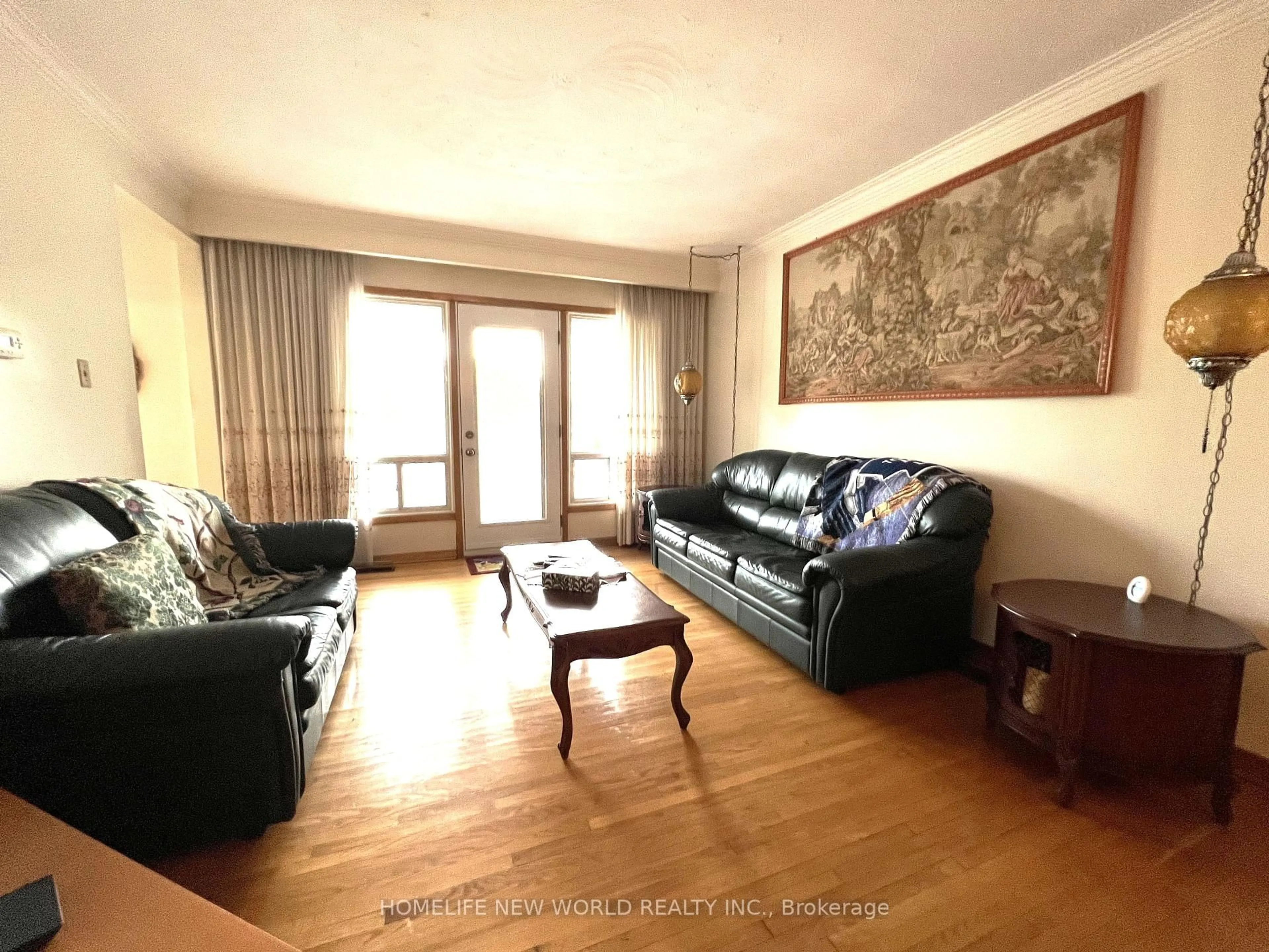 Living room with furniture, wood/laminate floor for 2A Fairglen Ave, Toronto Ontario M1T 1G7