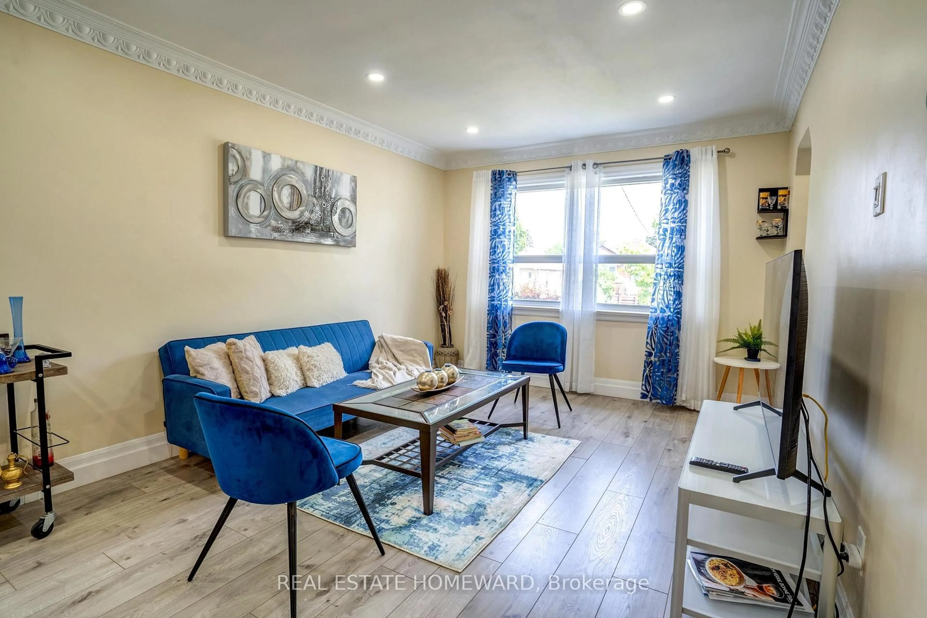Living room with furniture, wood/laminate floor for 39 Galbraith Ave, Toronto Ontario M4B 2B6