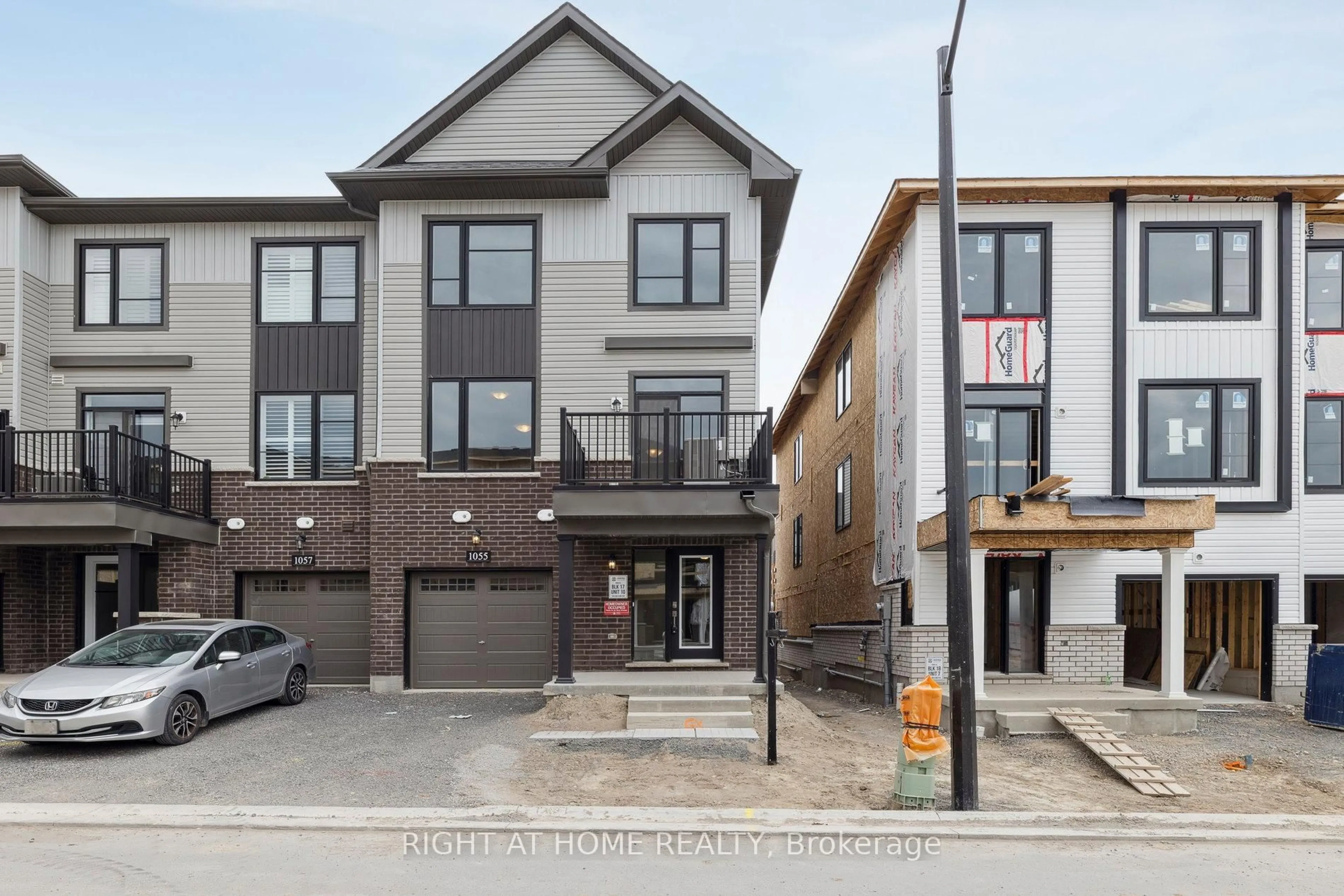 Home with brick exterior material, street for 1055 Honeycomb Path, Oshawa Ontario L1H 8L7