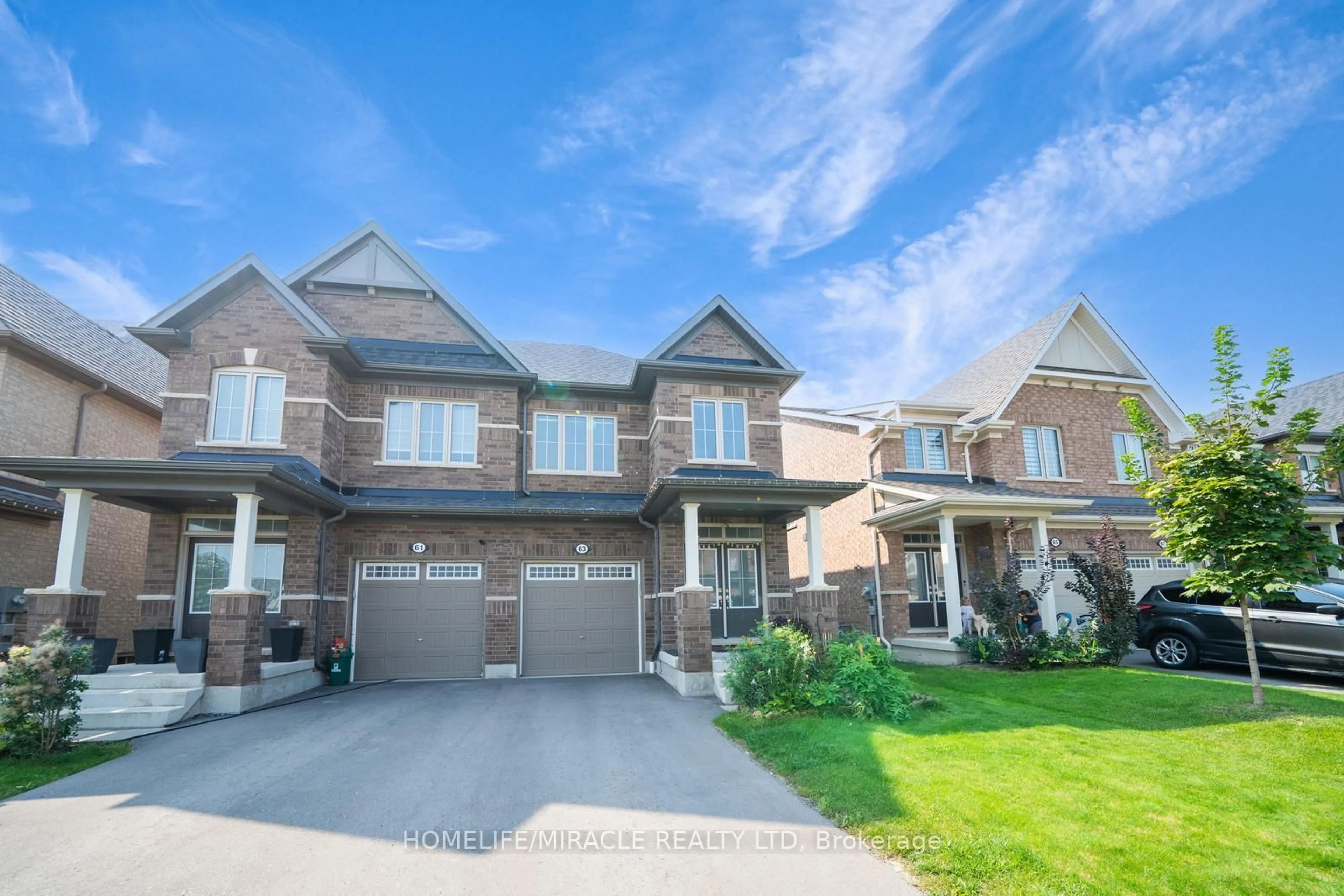 Home with brick exterior material, street for 63 Auckland Dr, Whitby Ontario L1P 0H4