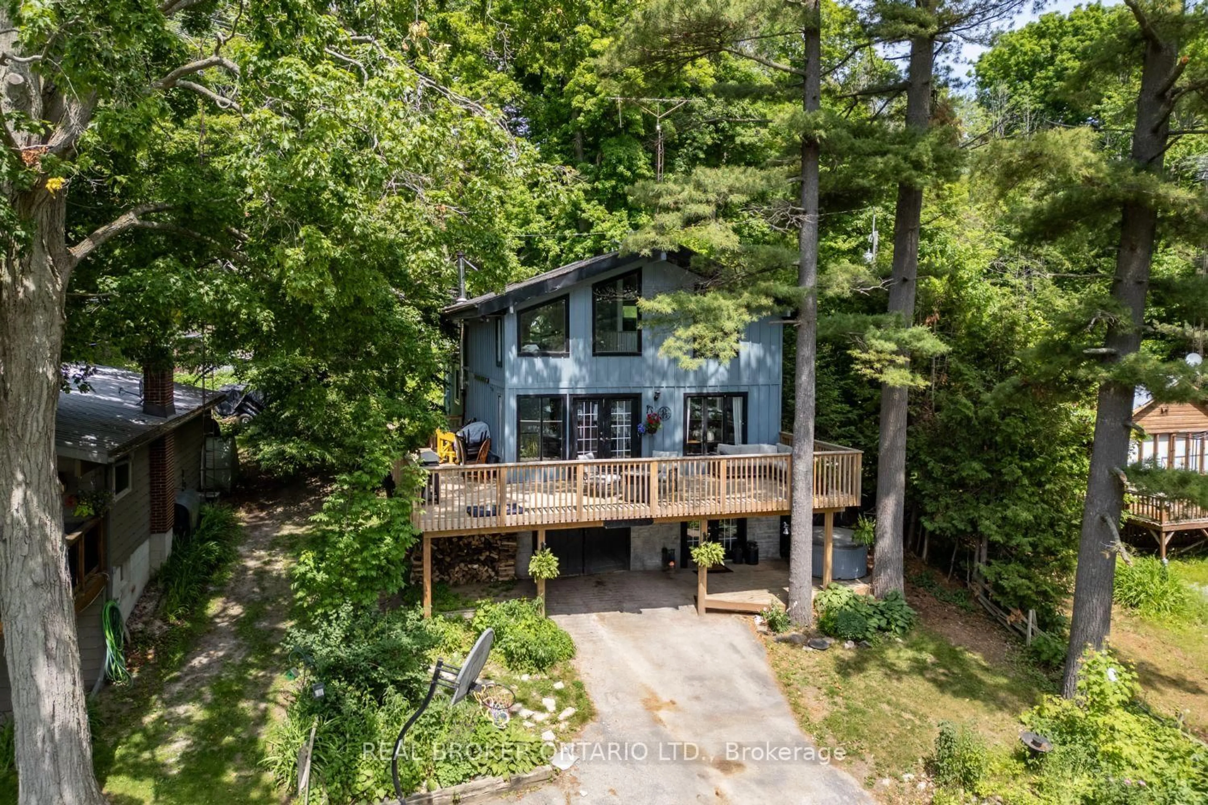 A pic from outside/outdoor area/front of a property/back of a property/a pic from drone, forest/trees view for 126 Pine Point Lane, Scugog Ontario L9L 1B4
