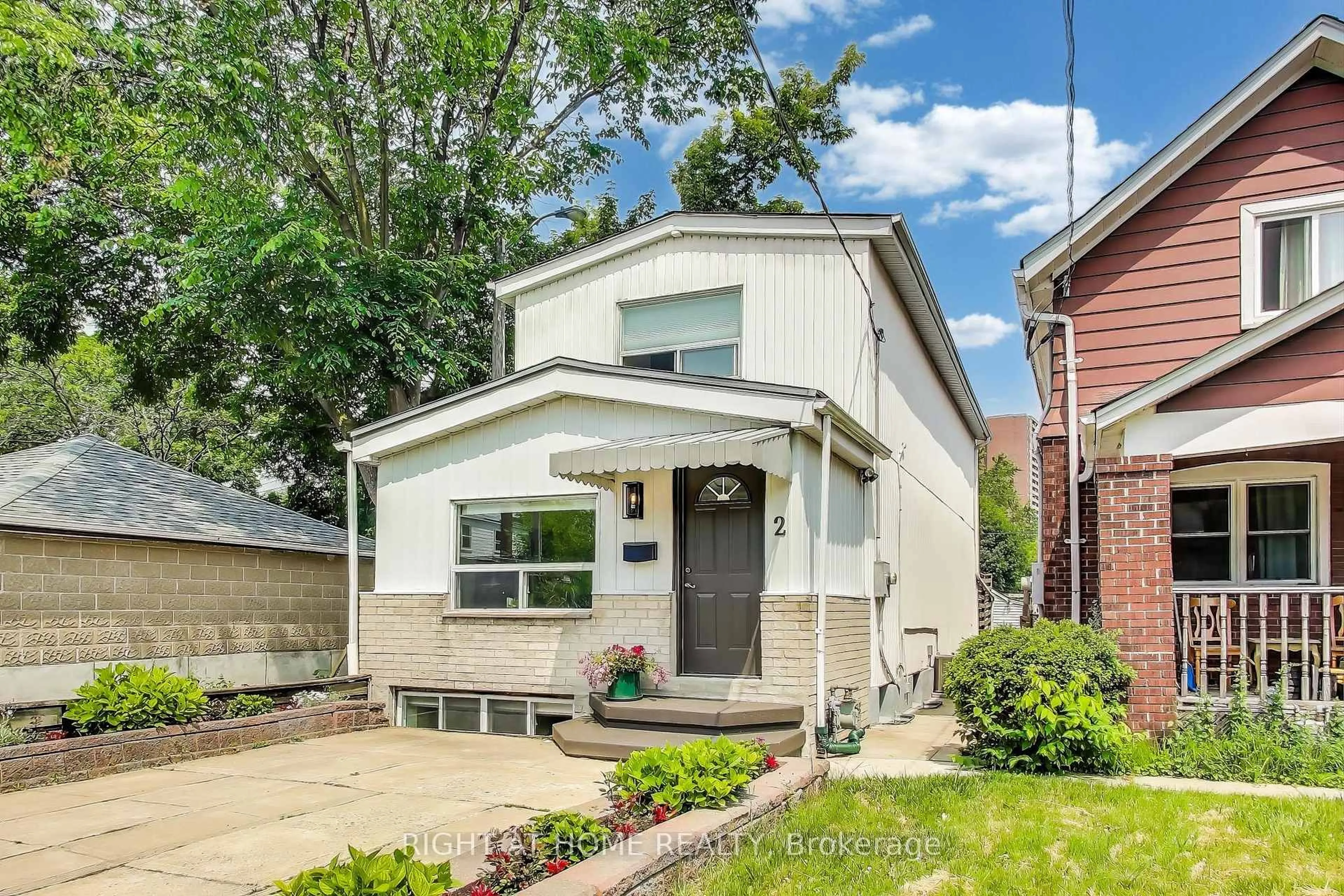 Home with vinyl exterior material, street for 2 sutherland Ave, Toronto Ontario M4C 1R9