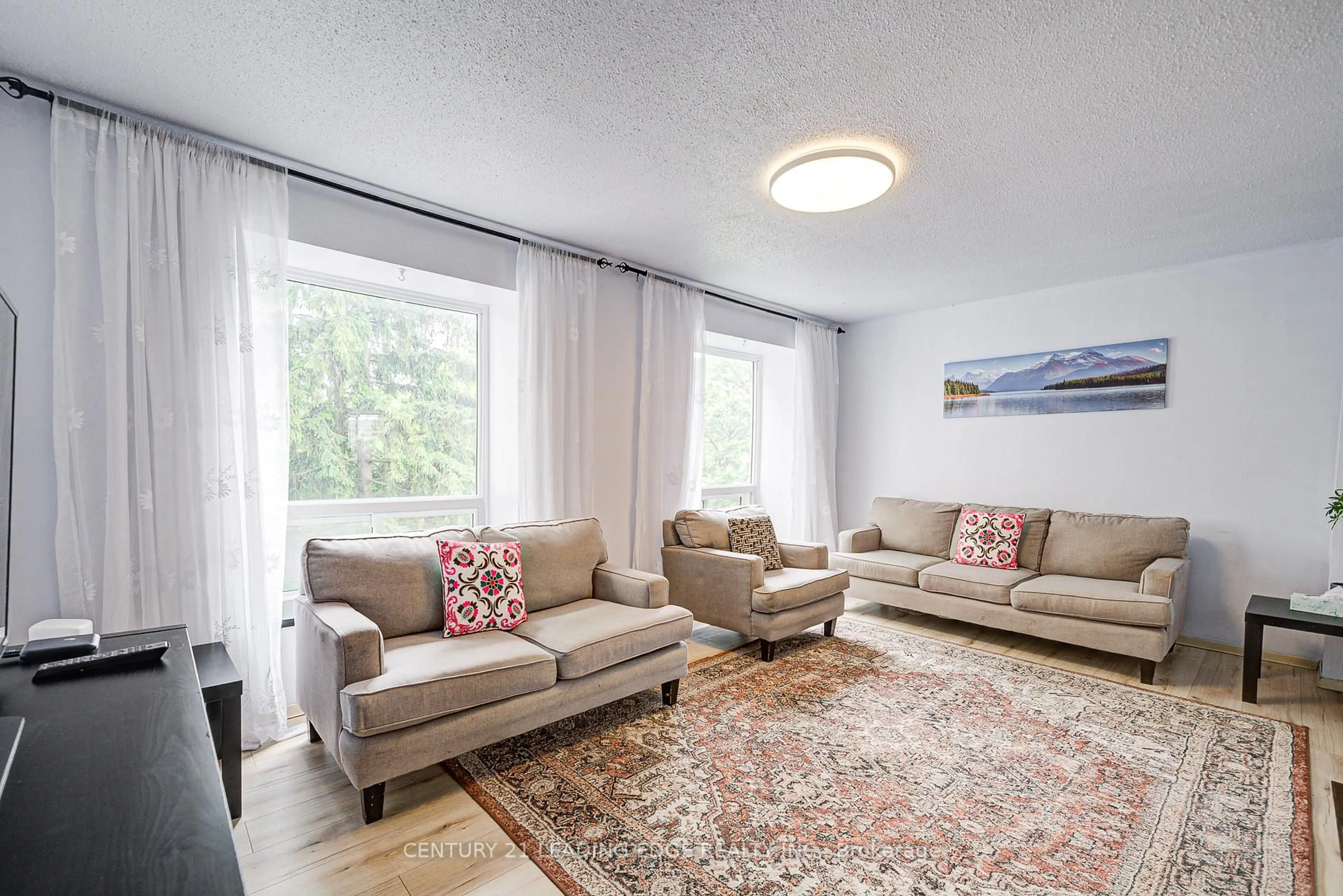 Living room with furniture, carpet floor for 25 Collinsgrove Rd #109, Toronto Ontario M1E 3S3