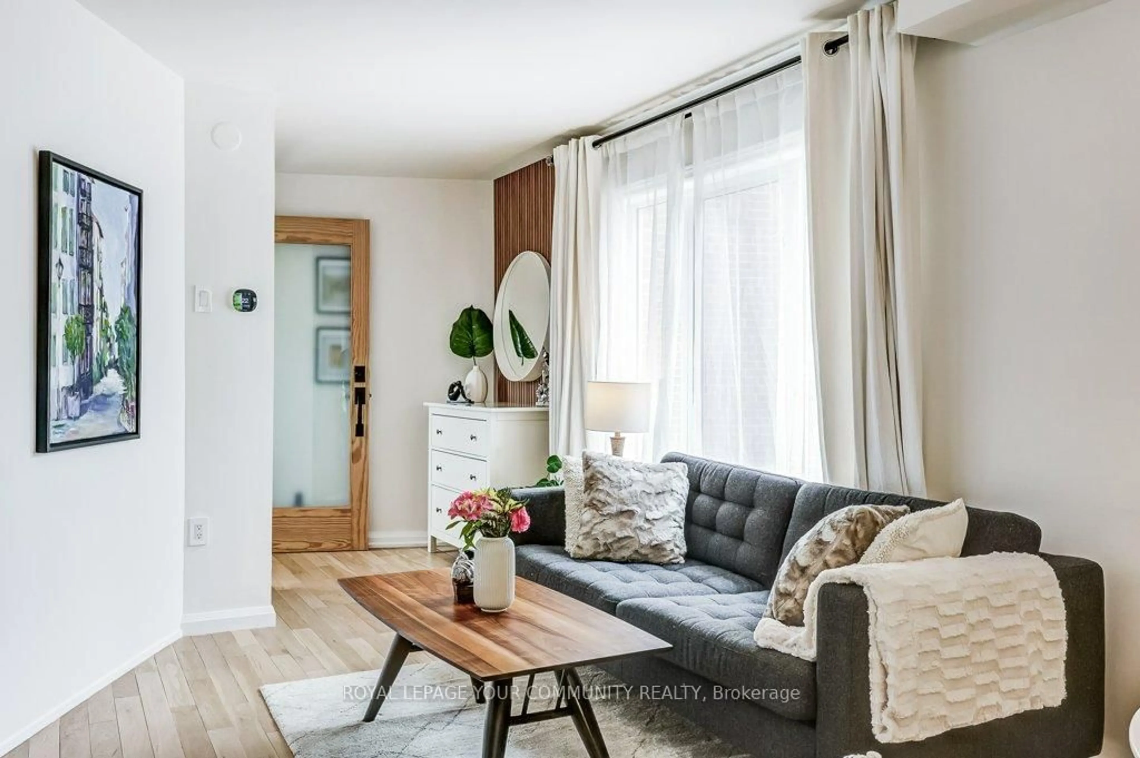 Living room with furniture, wood/laminate floor for 740 Kennedy Rd #6A, Toronto Ontario M1K 2C5