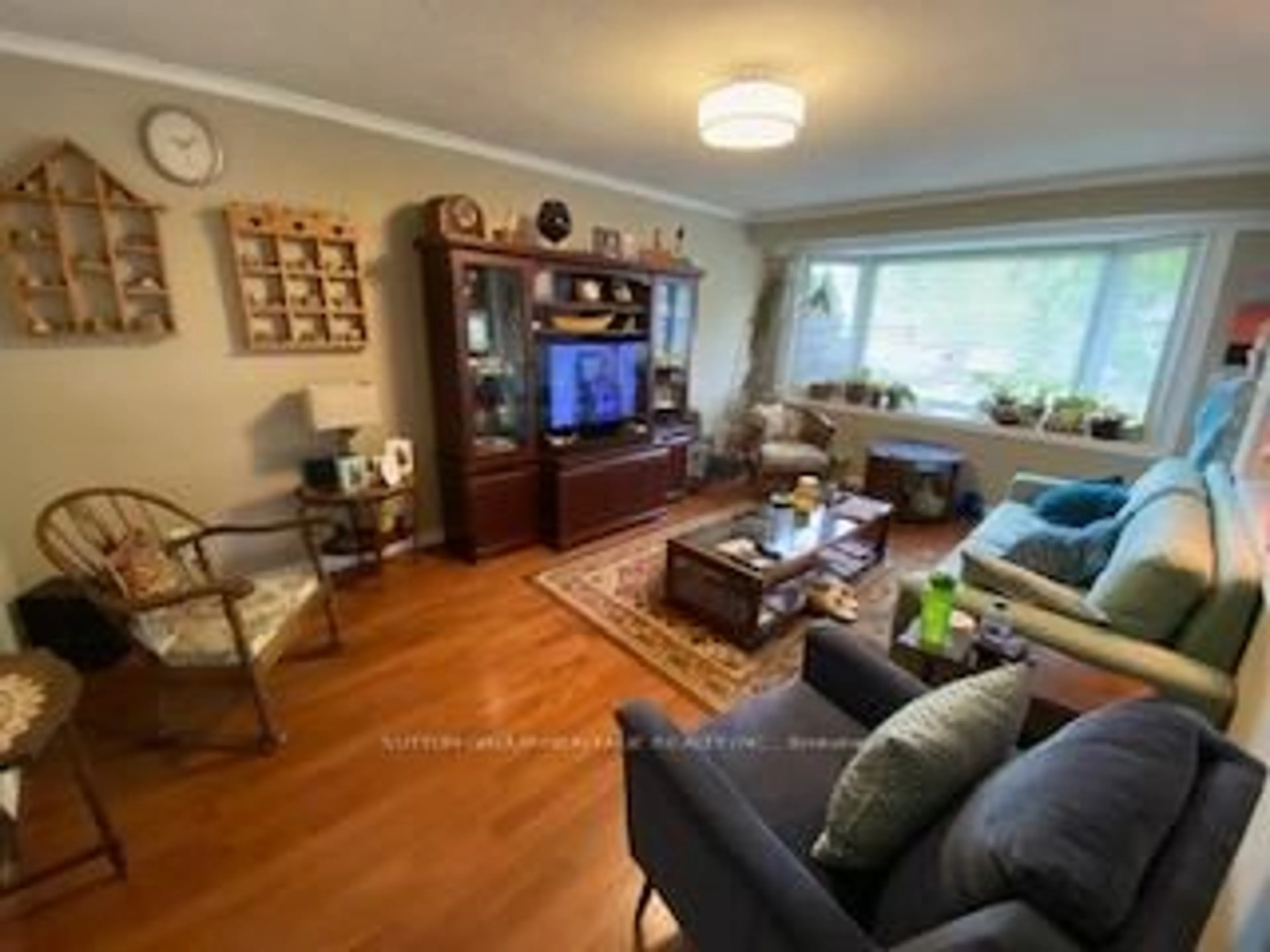 Living room with furniture, wood/laminate floor for 31 Lambs Lane, Clarington Ontario L1C 3G2