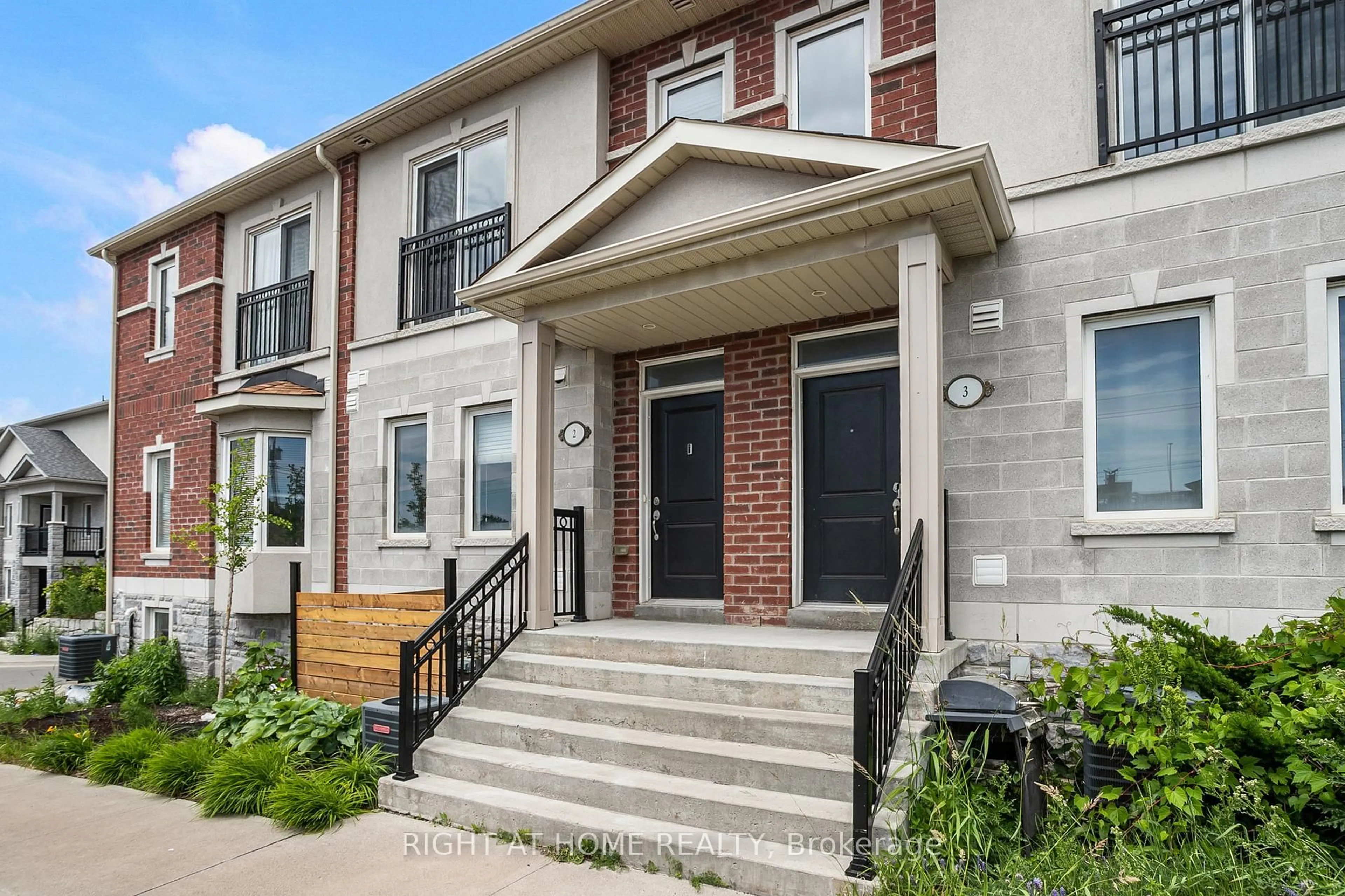 Home with brick exterior material, street for 1020 Dunsley Way #2, Whitby Ontario L1N 0L5